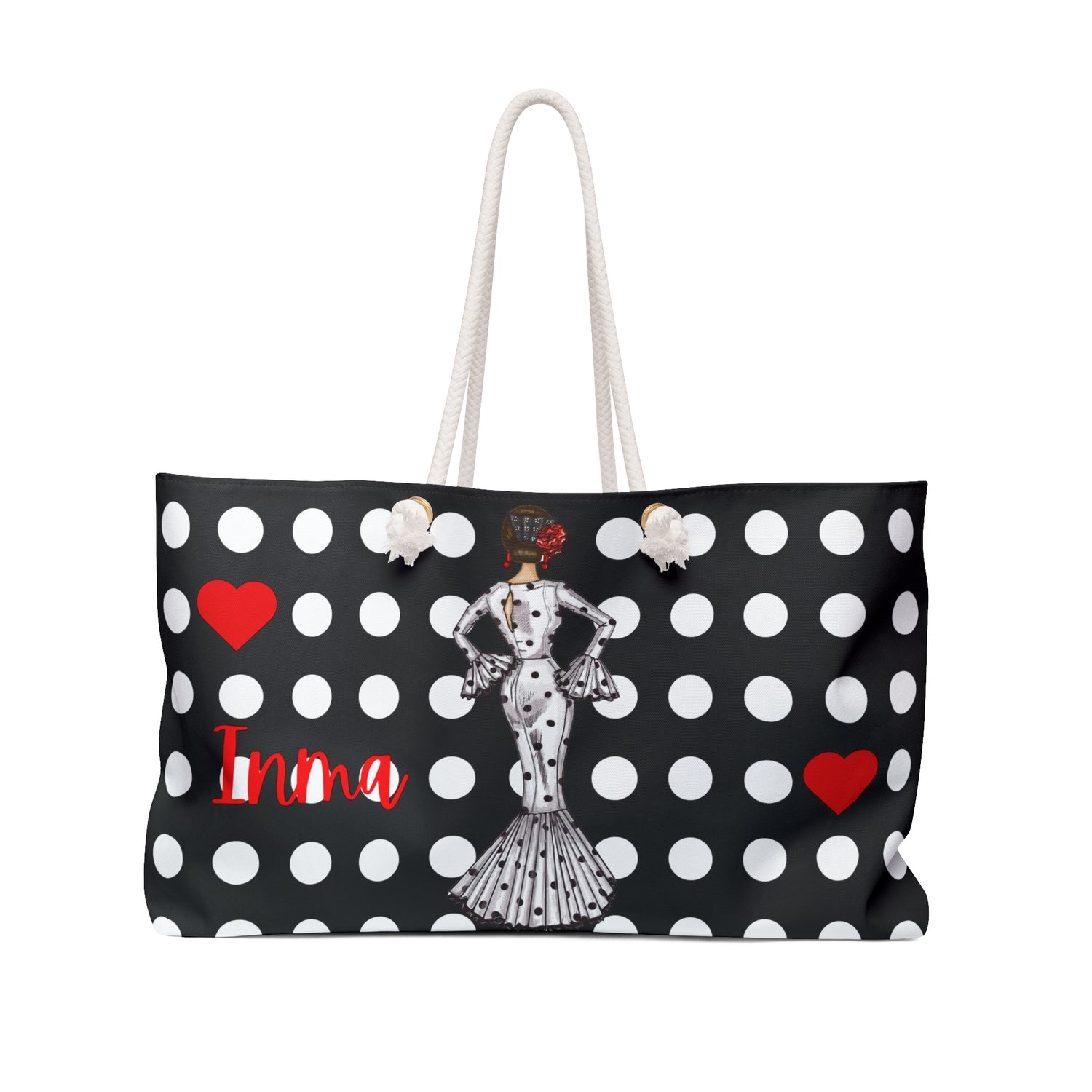 a black and white polka dot bag with a lady on it