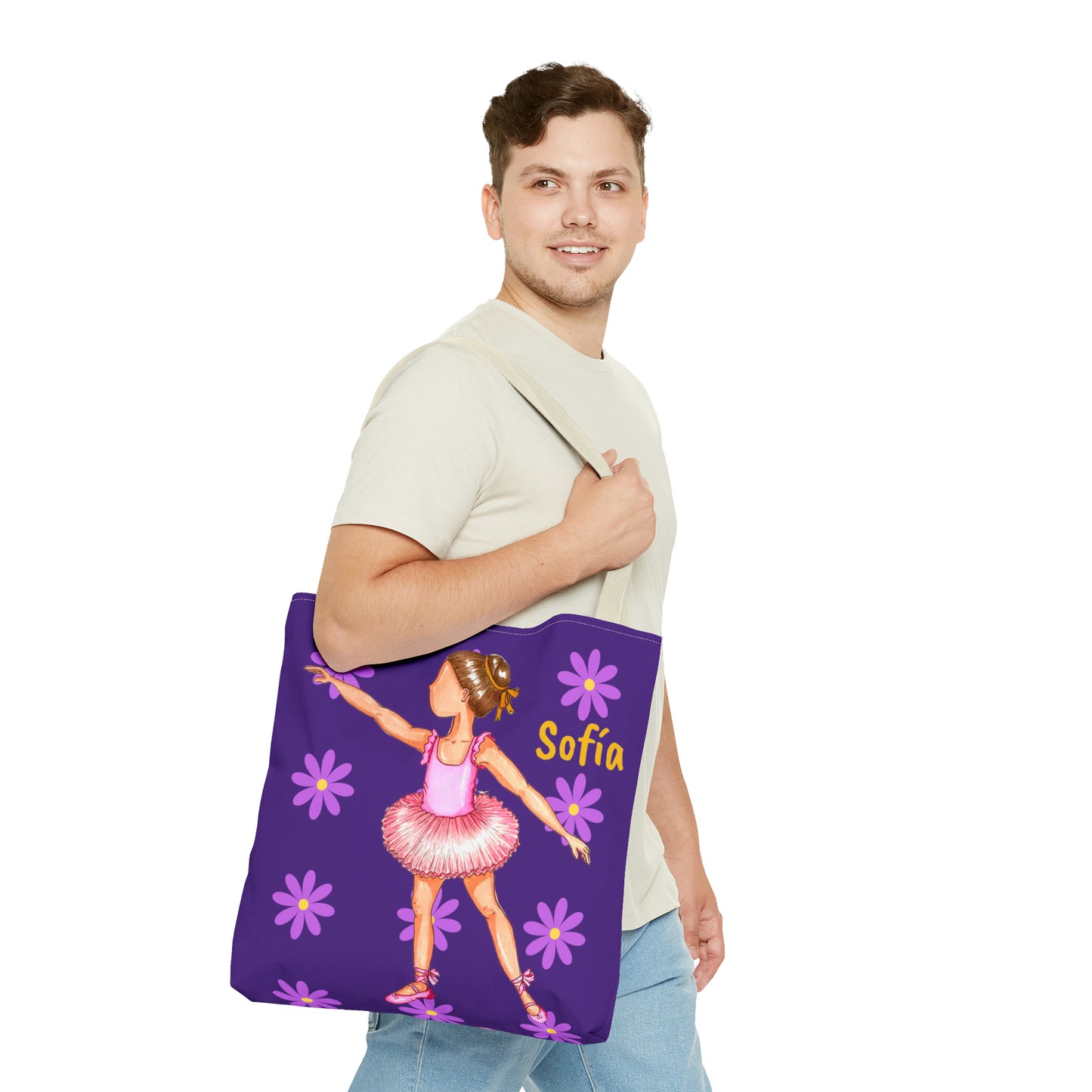 a man holding a purple tote bag with a picture of a ballerina
