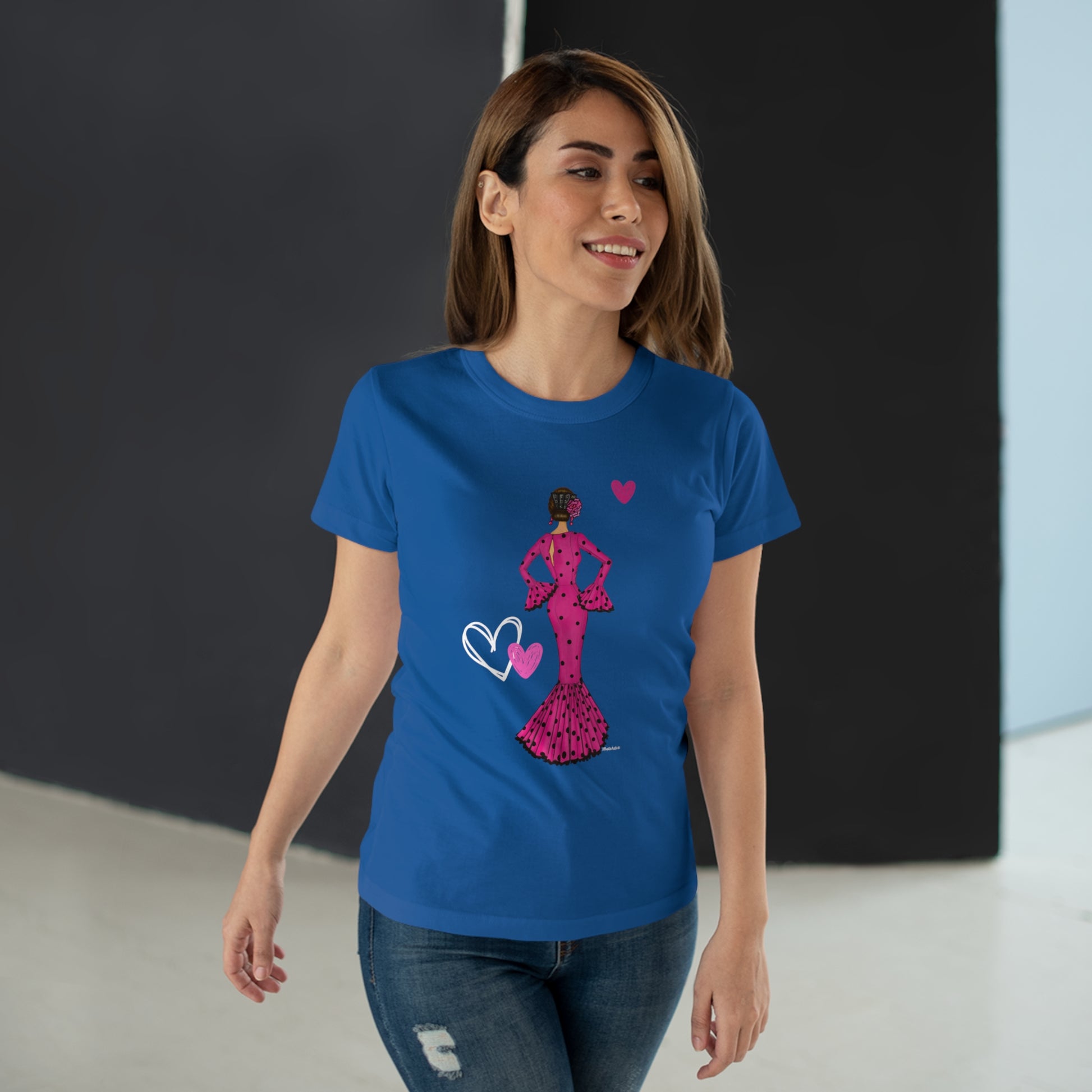 a woman wearing a blue t - shirt with a pink silhouette of a woman