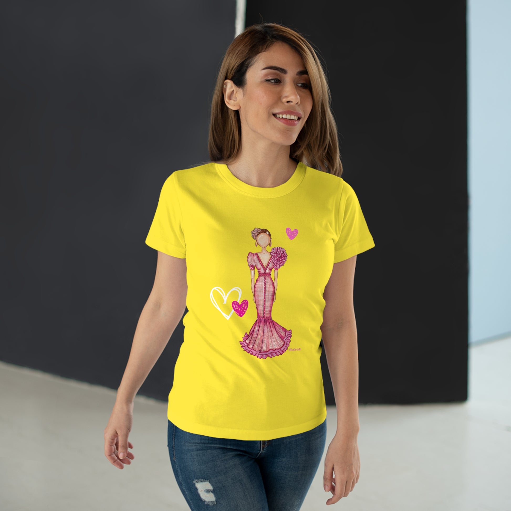 a woman wearing a yellow t - shirt with a picture of a woman in a