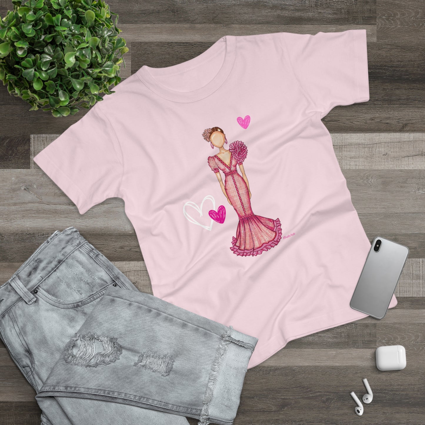 a pink t - shirt with a picture of a woman in a pink dress