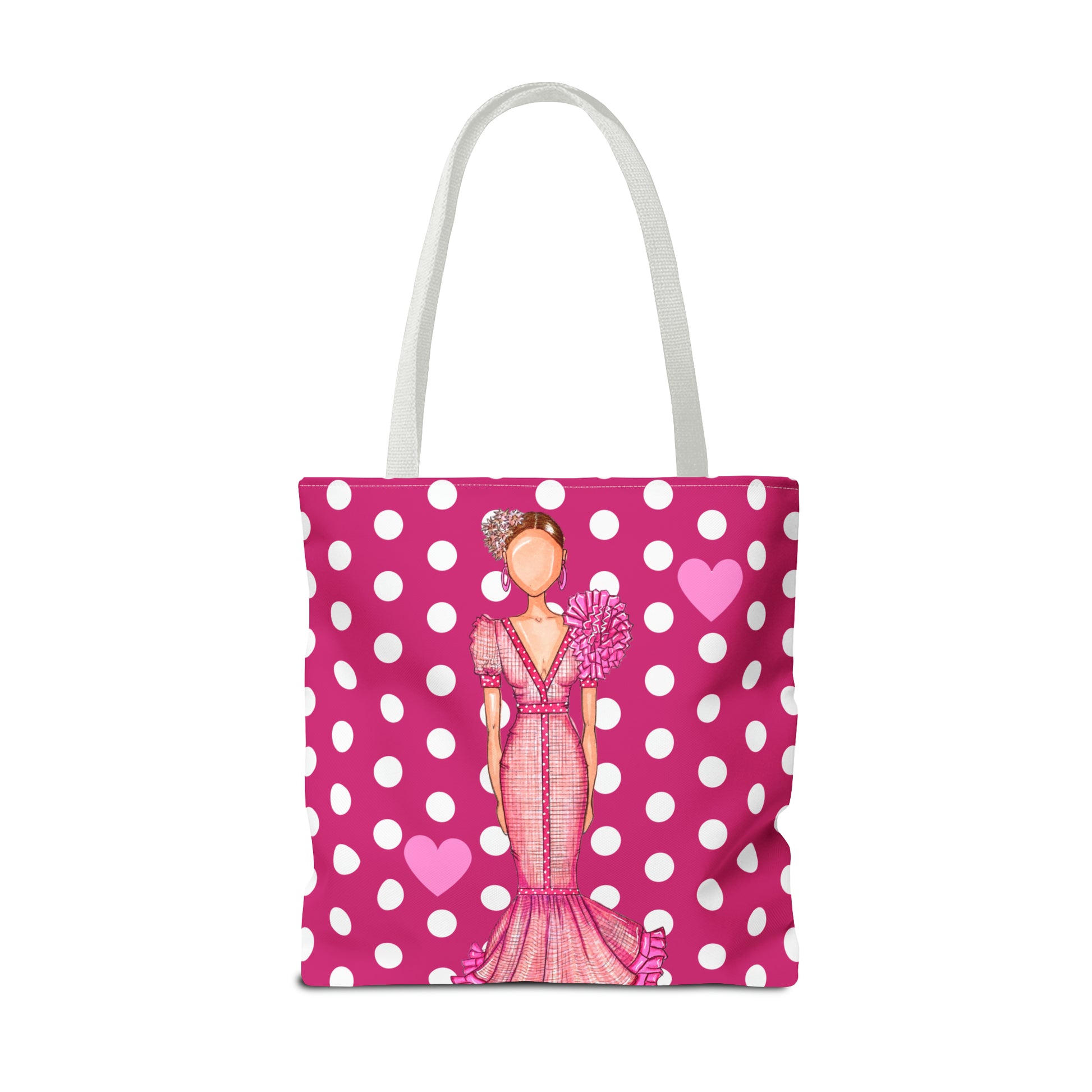 a pink and white polka dot bag with a picture of a woman in a dress