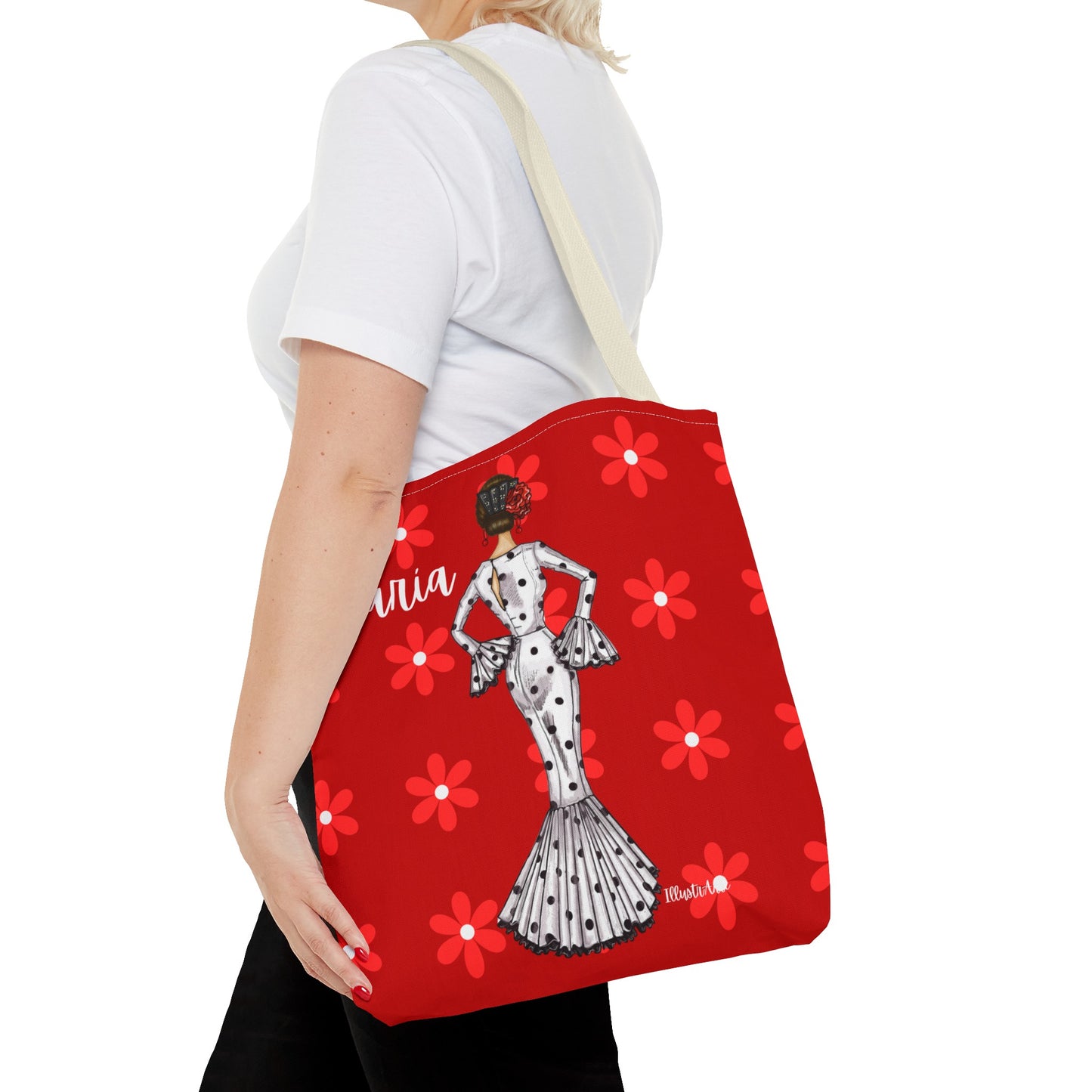 a woman carrying a red bag with a picture of a woman on it