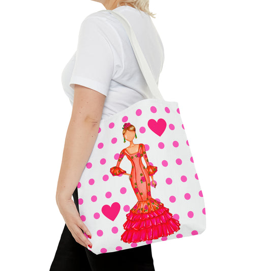 a woman carrying a pink and white polka dot purse