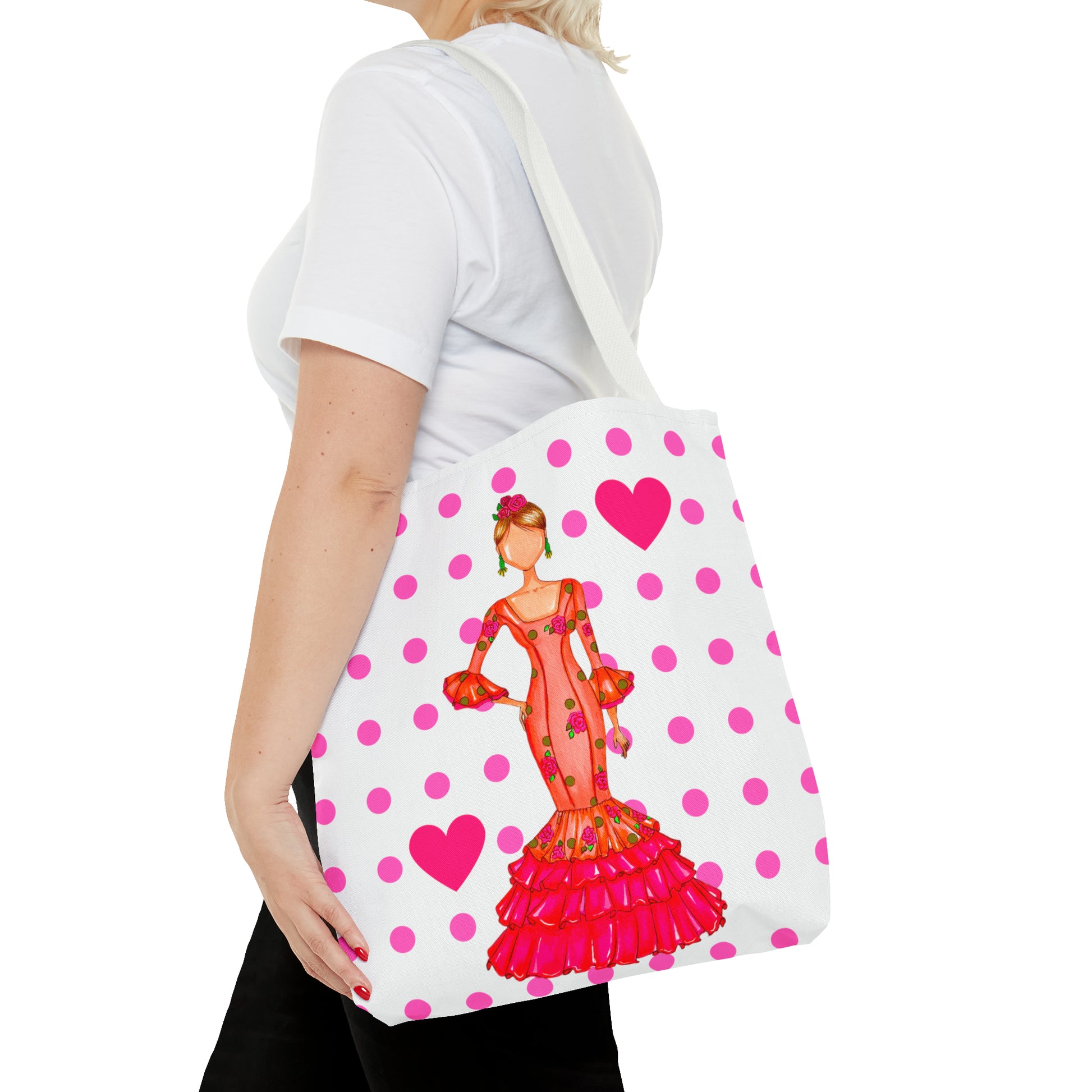 a woman carrying a pink and white polka dot purse