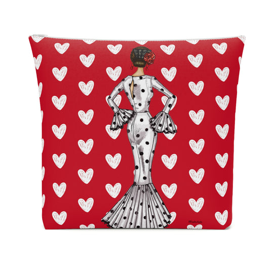 a red pillow with a picture of a woman on it