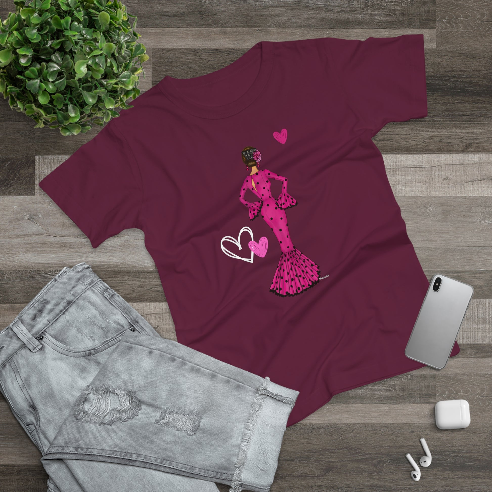a women's t - shirt with a graphic of a woman in a pink