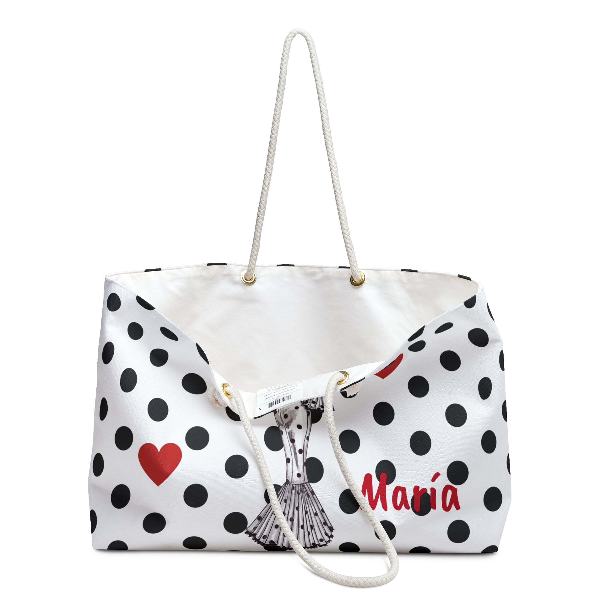 a white polka dot bag with a red heart on it