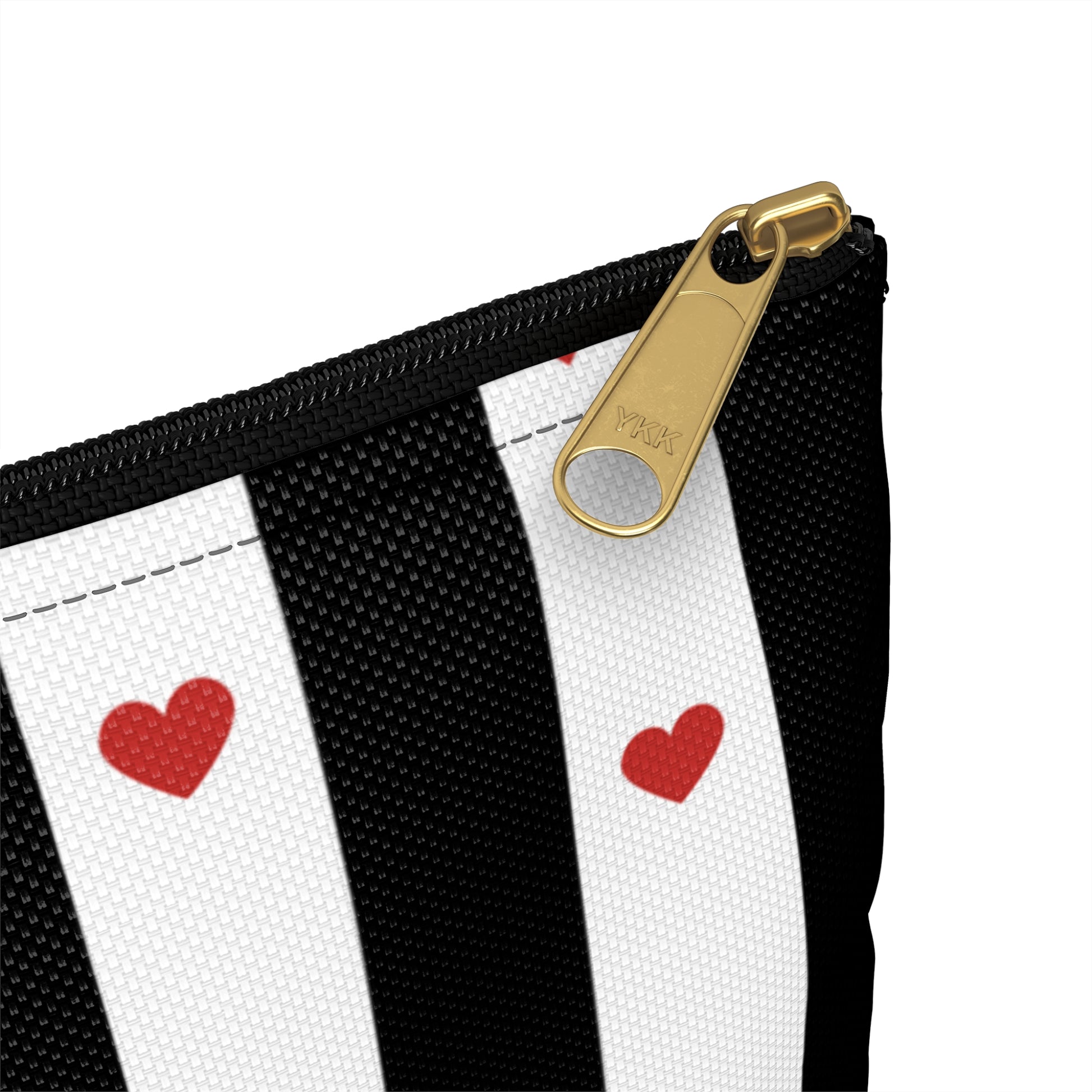 a black and white striped purse with red hearts on it