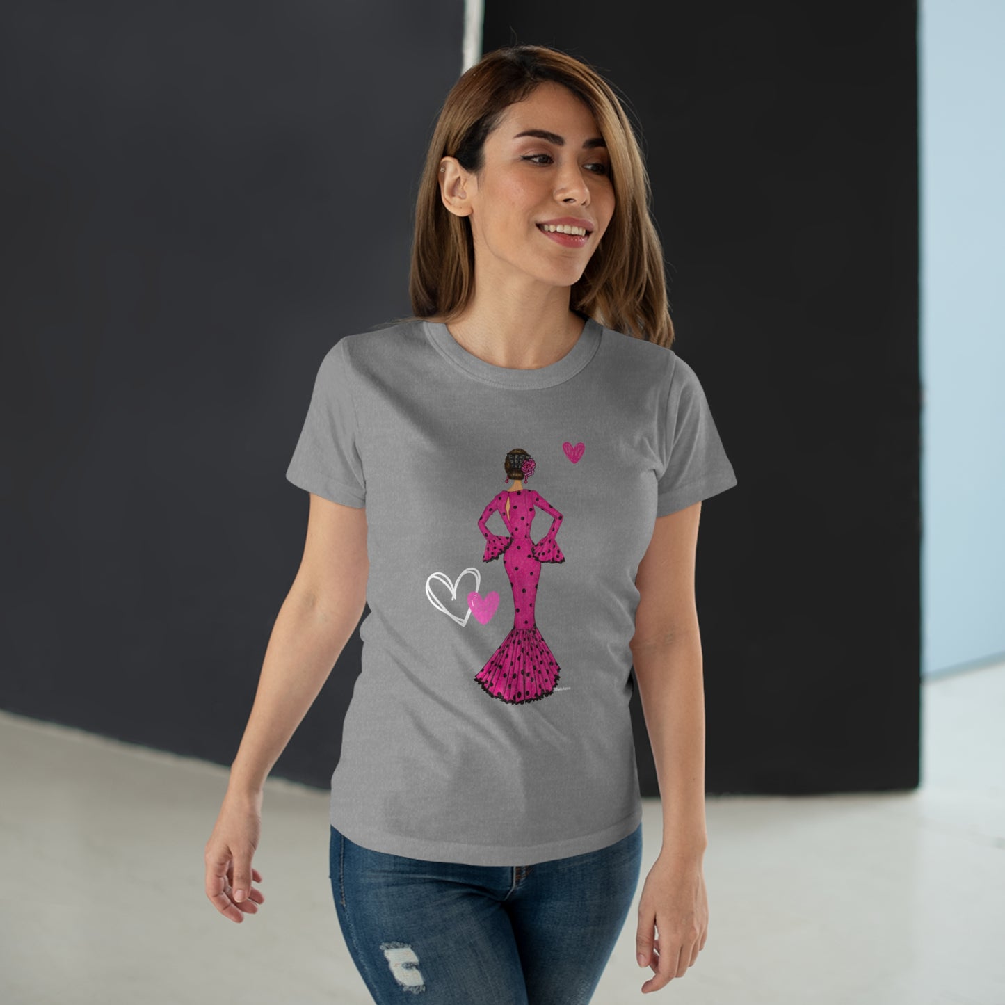 a woman wearing a t - shirt with a pink dress on it