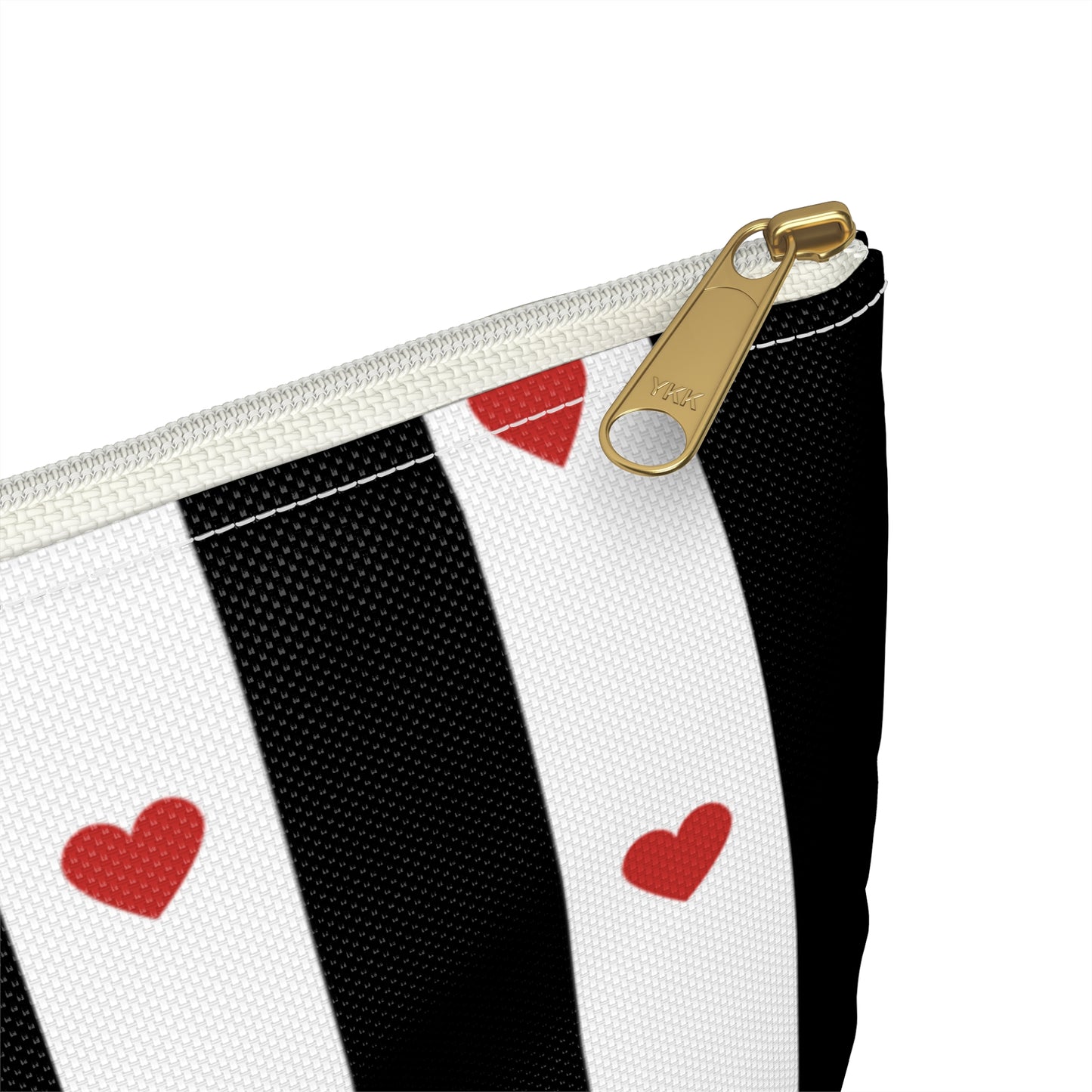 a black and white striped bag with red hearts on it