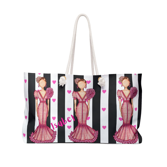 a handbag with a picture of a woman in a pink dress