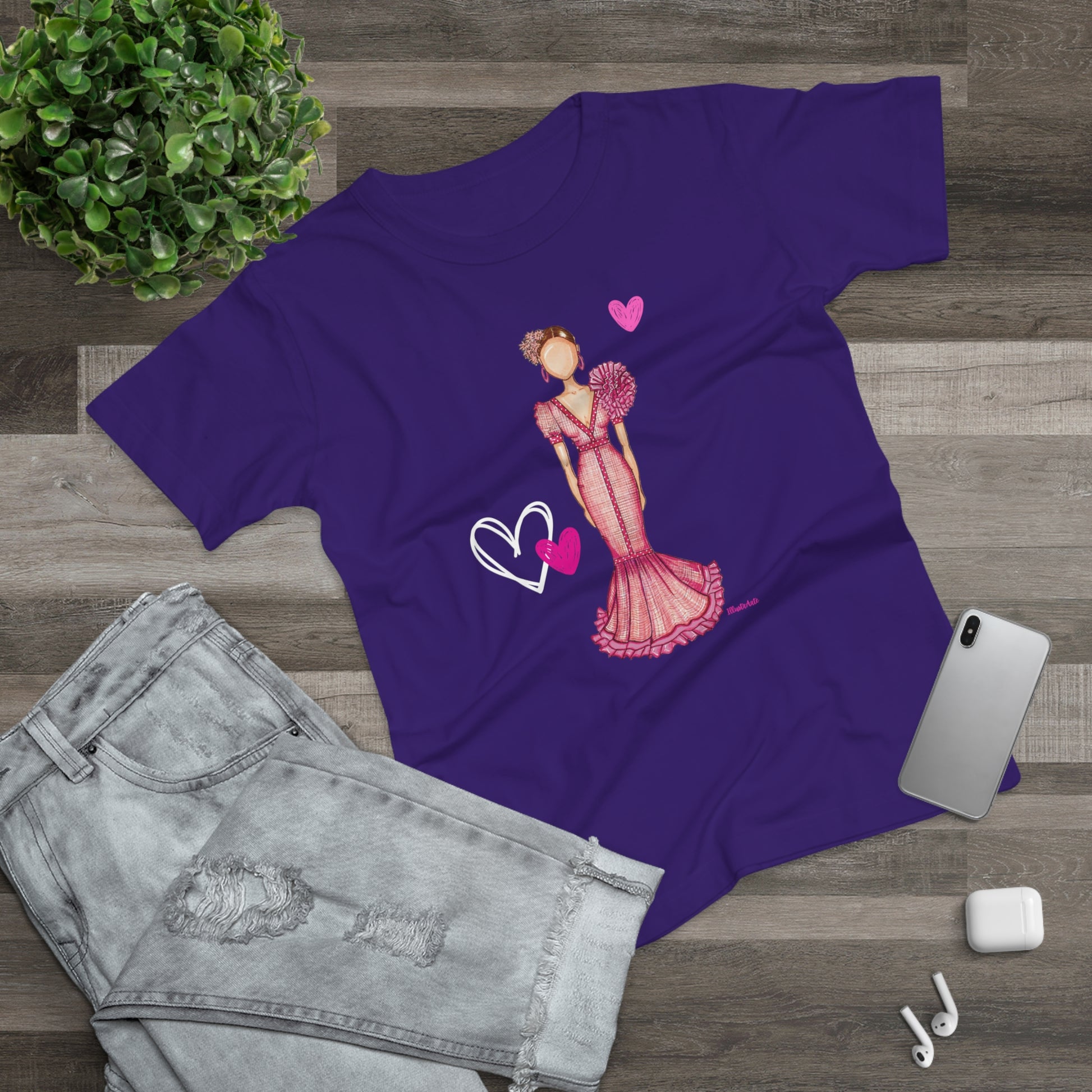a purple t - shirt with a picture of a woman in a dress