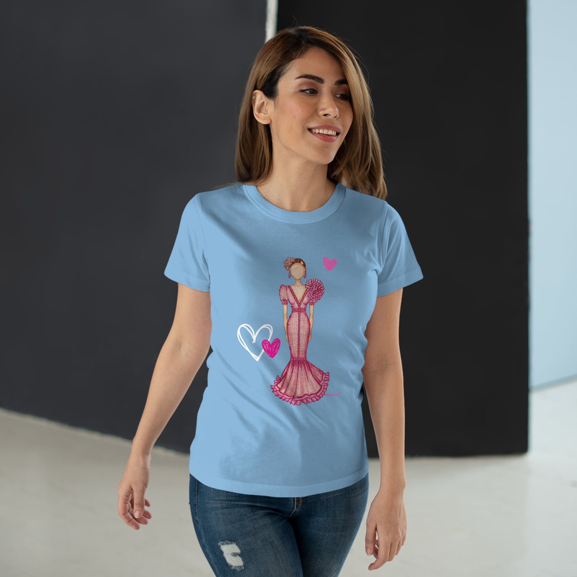 a woman wearing a blue t - shirt with a picture of a woman in a