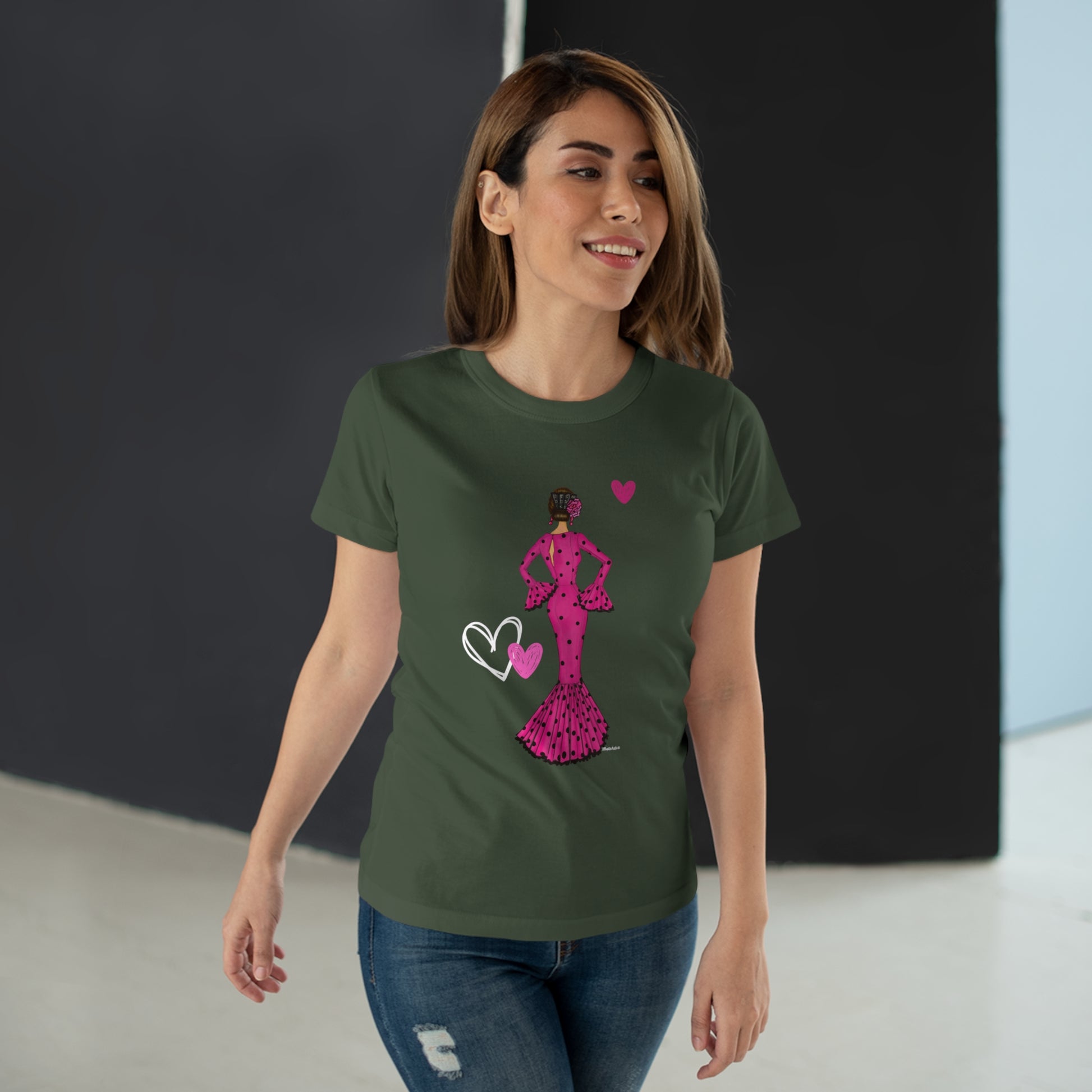 a woman wearing a green t - shirt with a pink silhouette of a woman