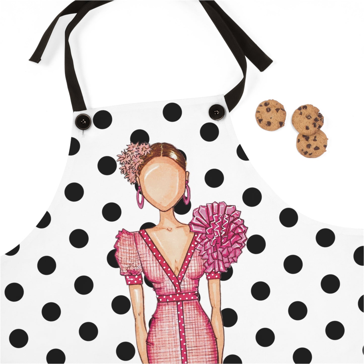an apron with a picture of a woman holding a cookie