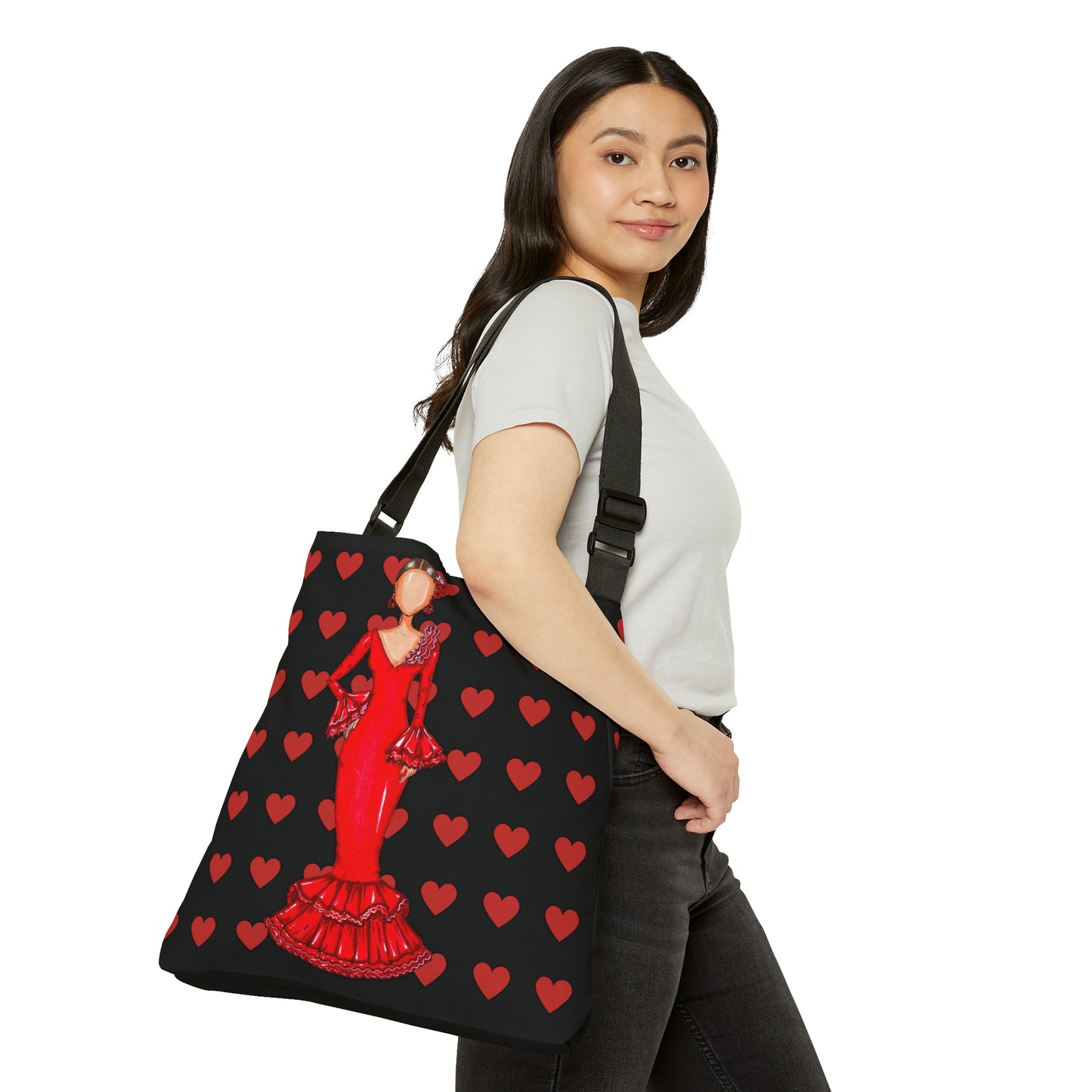 a woman carrying a black and red tote bag