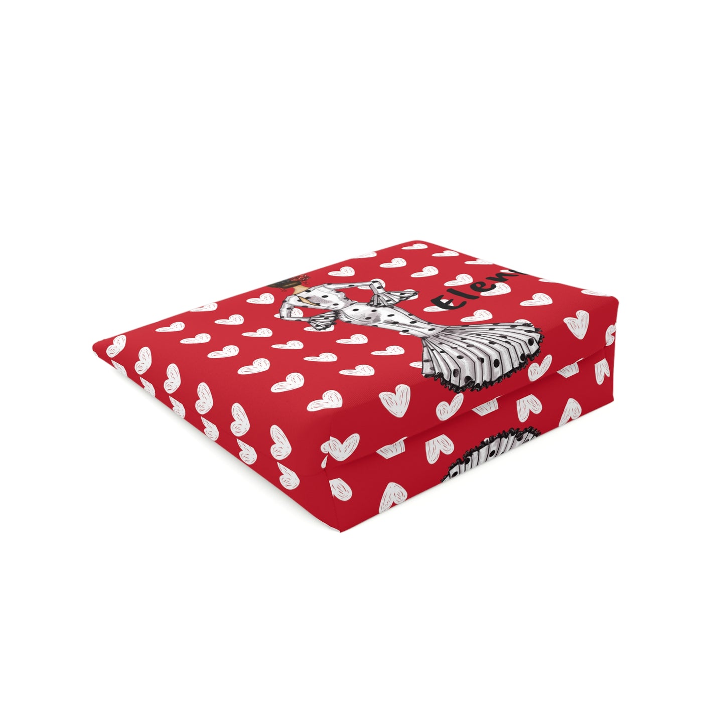 a red blanket with white hearts and a zebra on it
