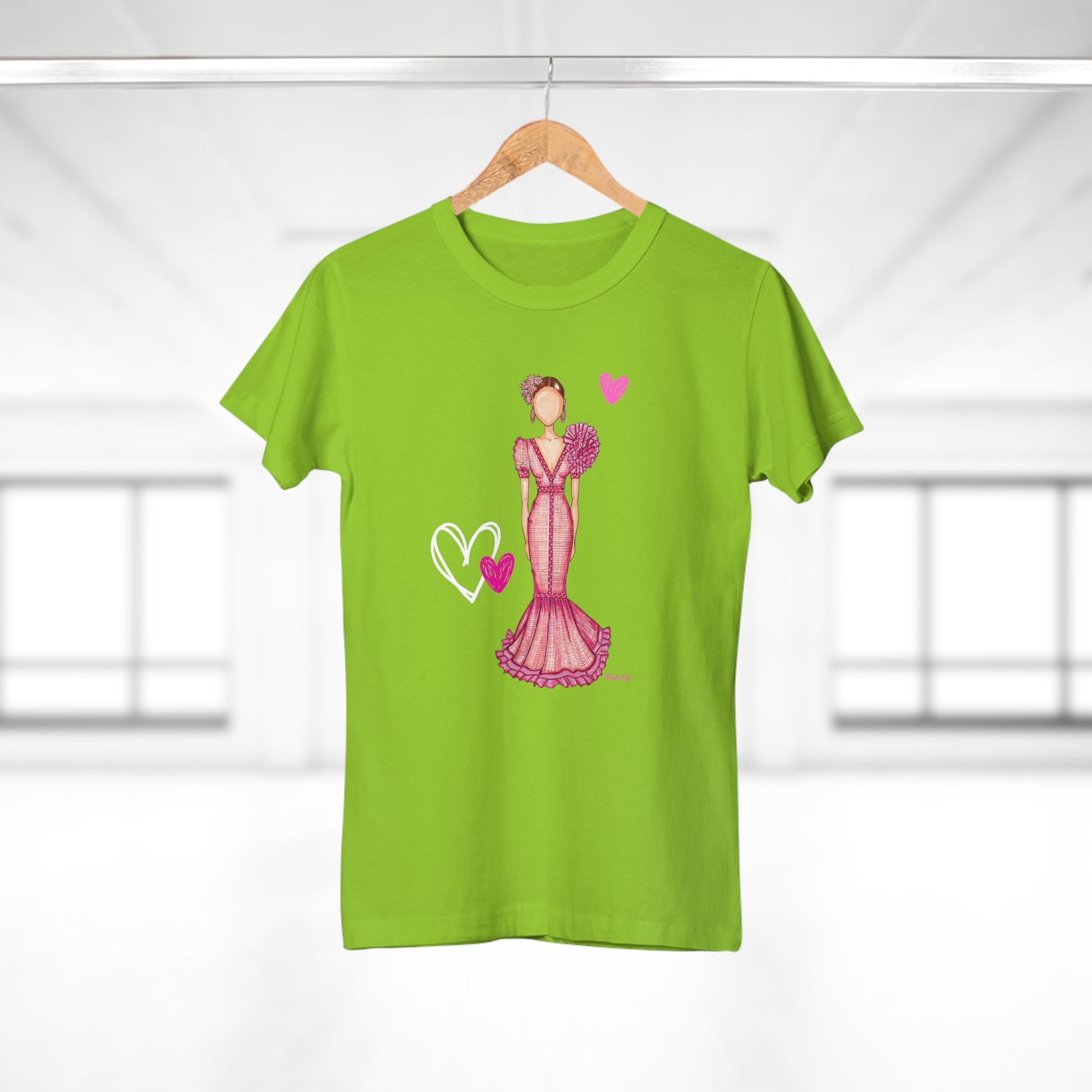 a green t - shirt with a picture of a woman in a pink dress
