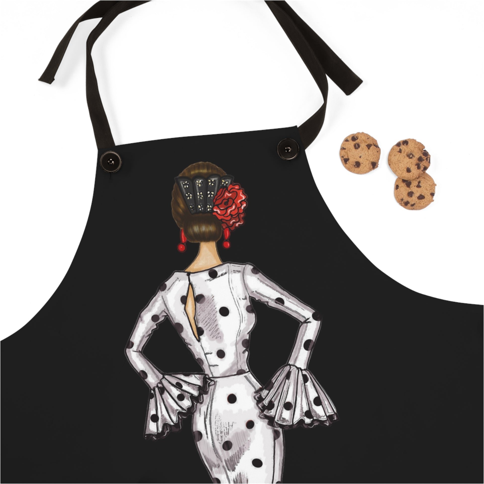 a black apron with a picture of a woman in a polka dot dress and cookies