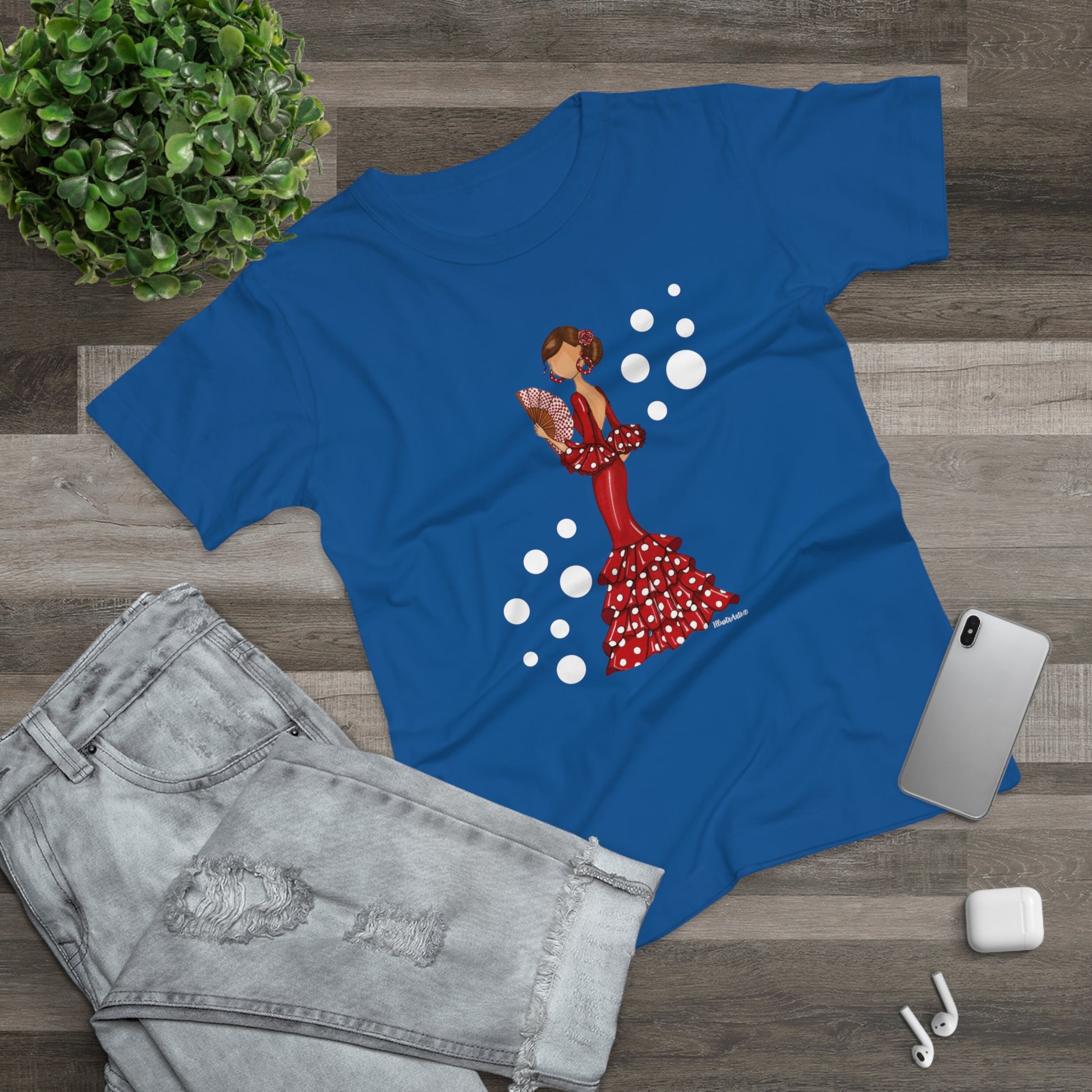 a blue t - shirt with a picture of a woman in a polka dot dress