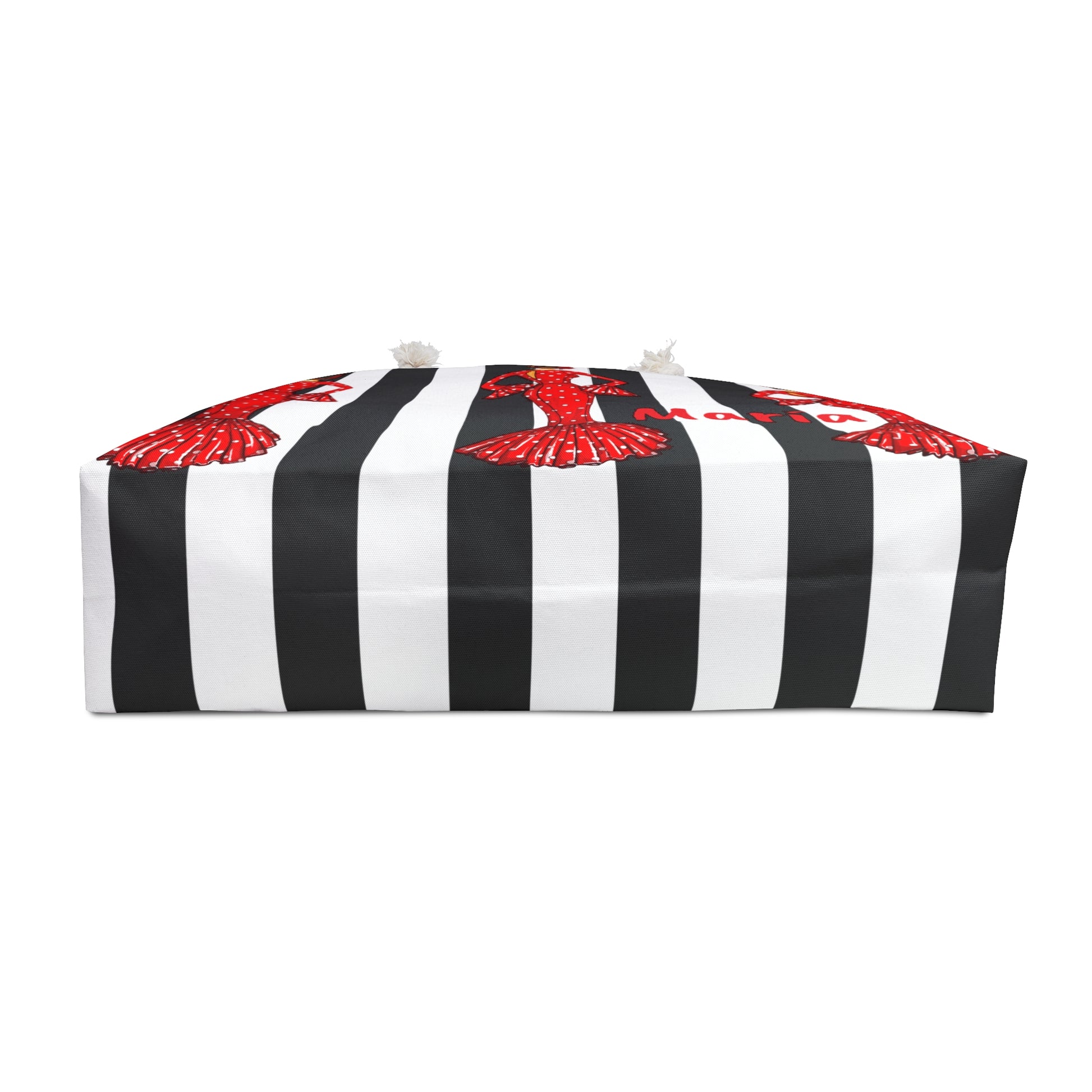 a black and white striped bag with red flowers on it
