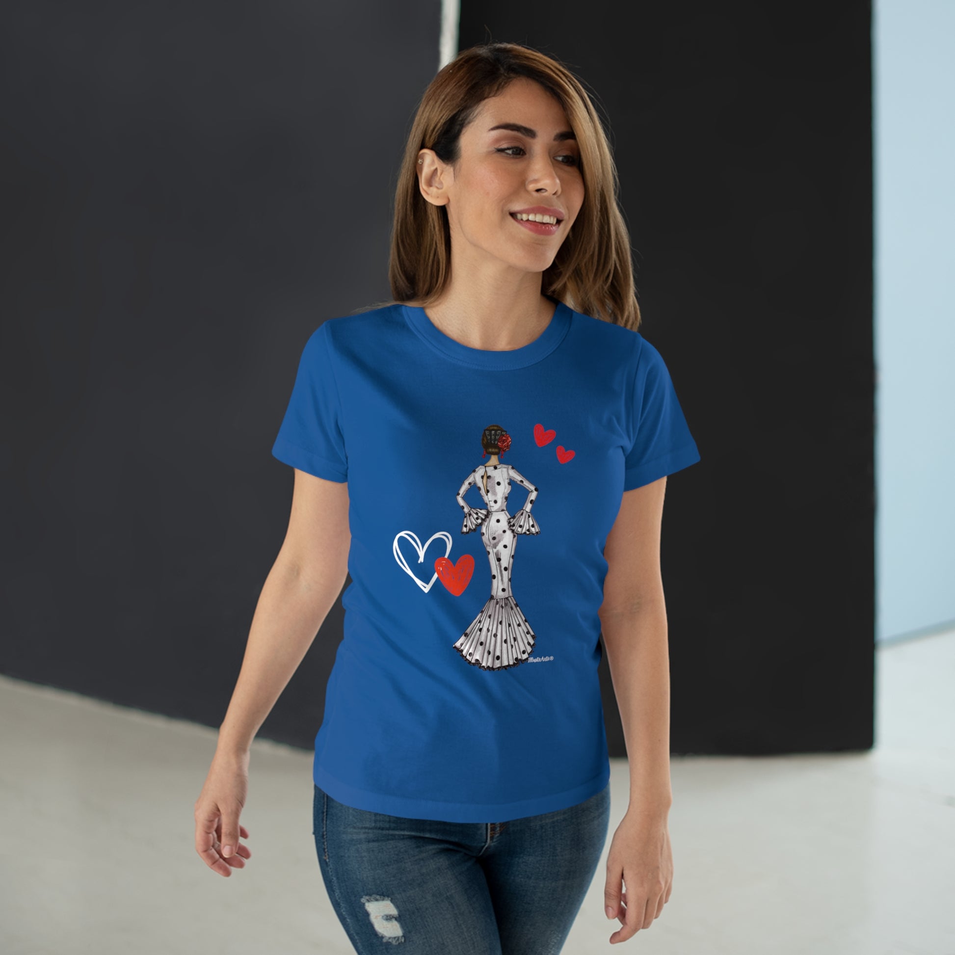 a woman wearing a blue t - shirt with a graphic of a woman holding a