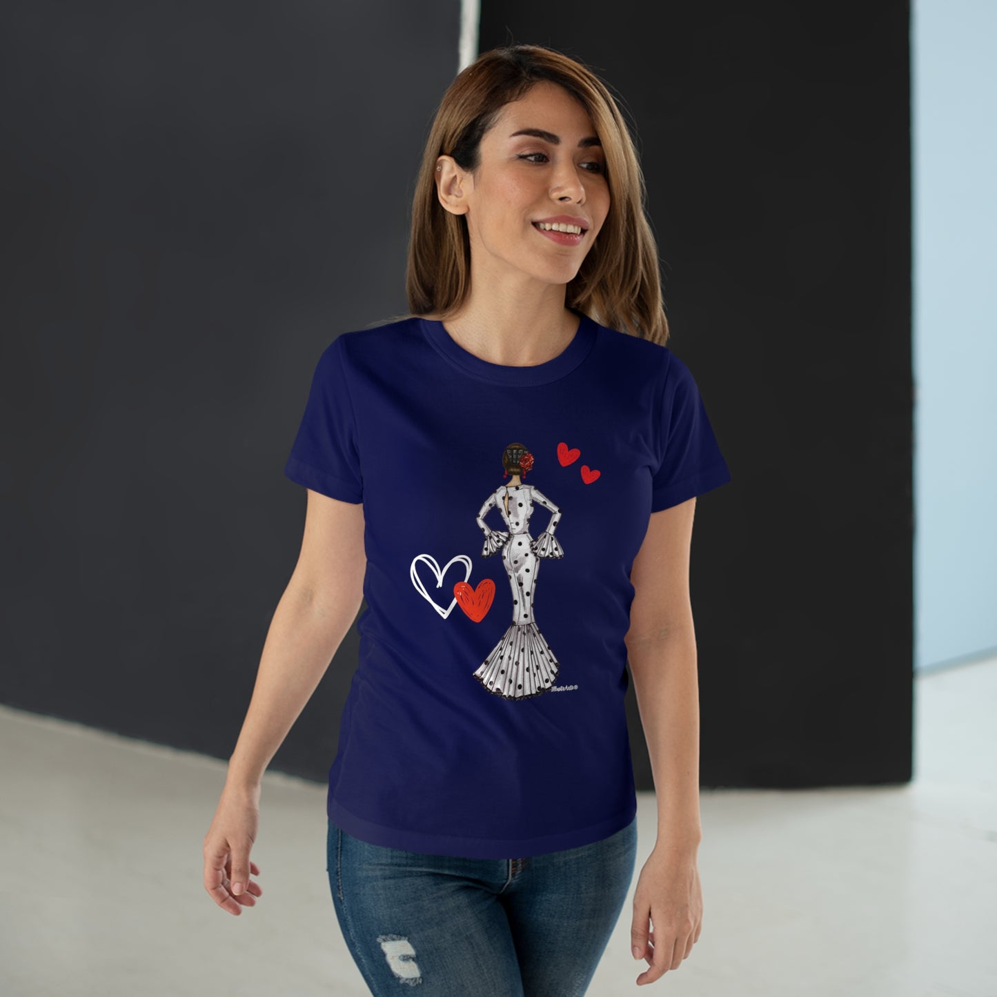 a woman wearing a blue t - shirt with a heart on it