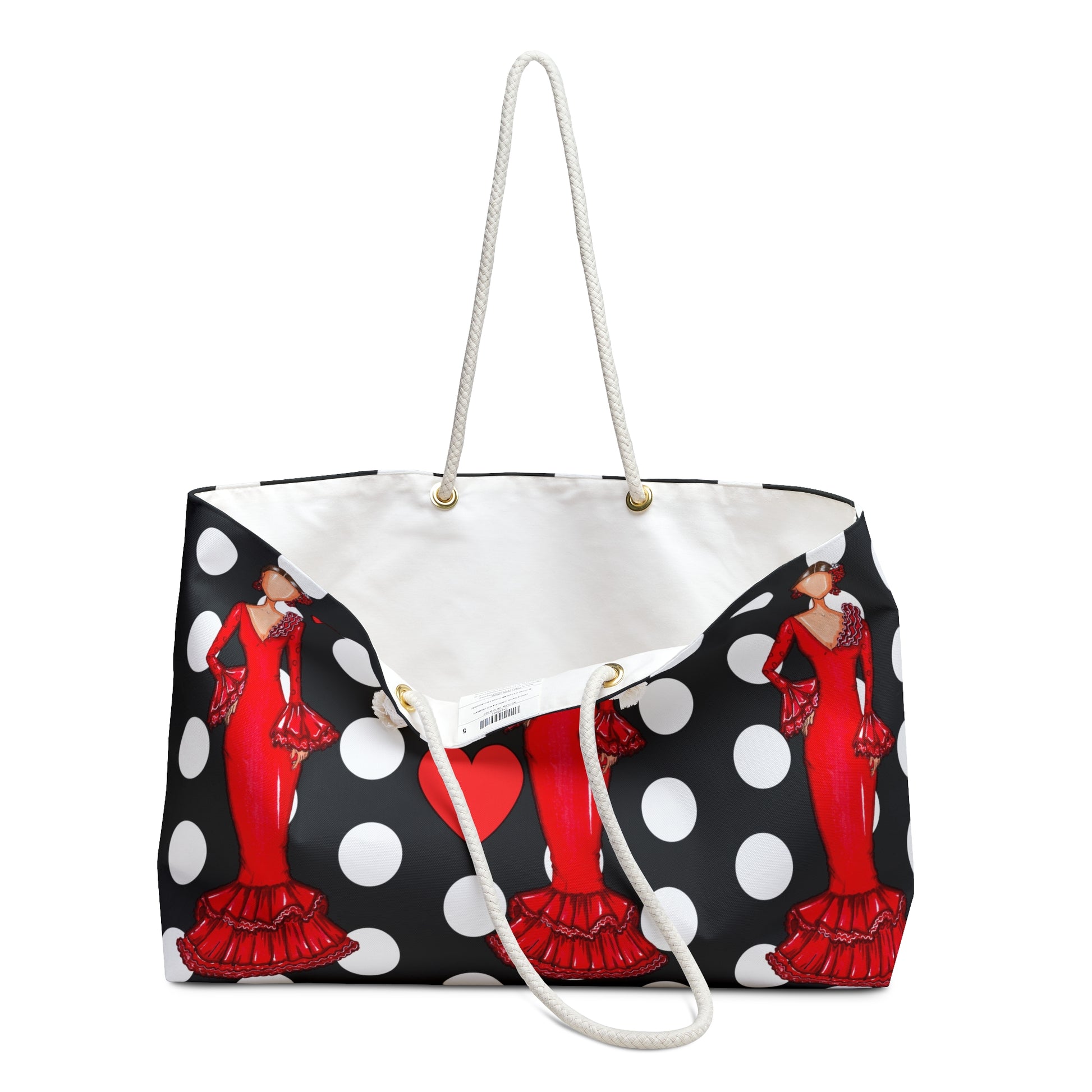 a black and white polka dot purse with a red woman on it