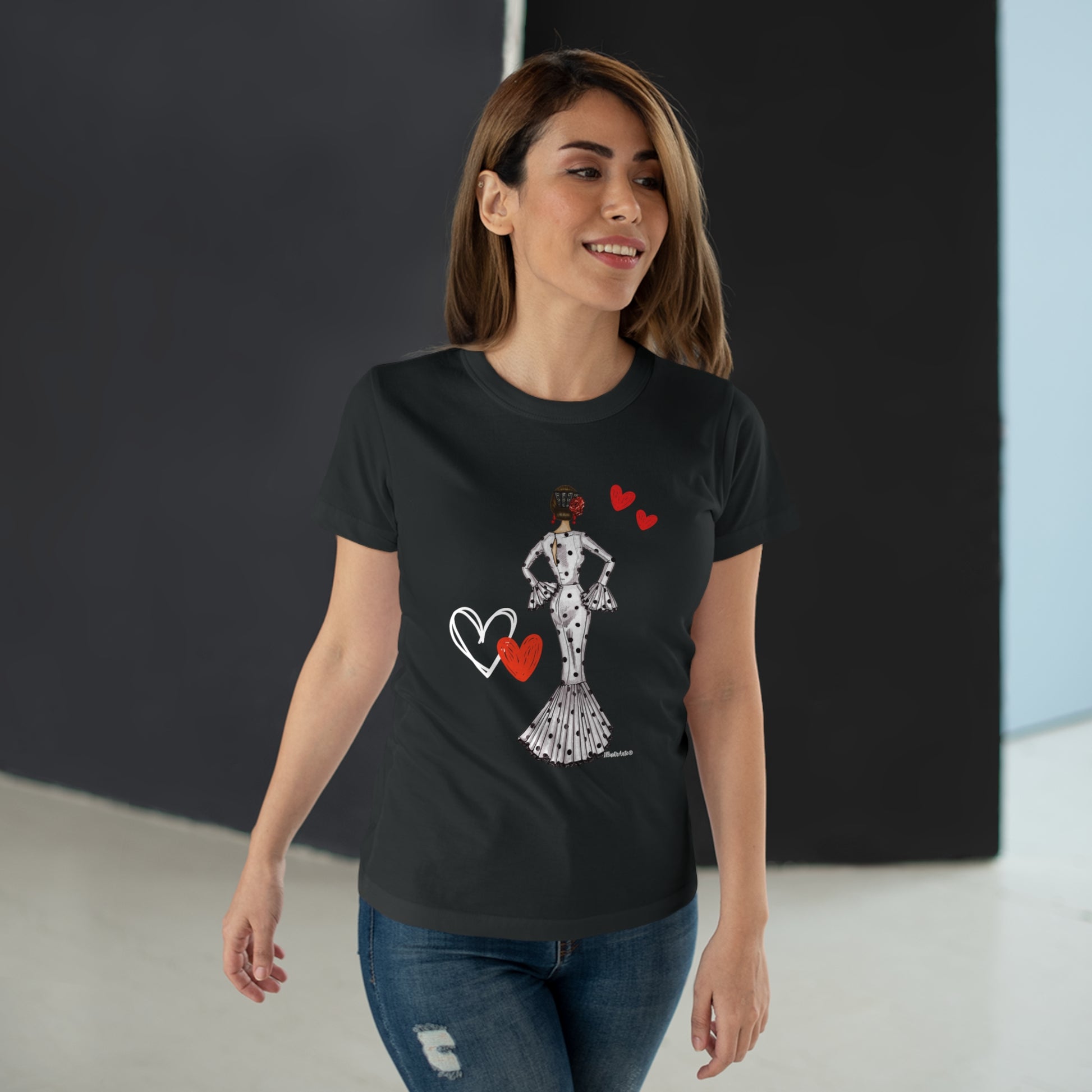 a woman wearing a black t - shirt with a picture of a woman holding a