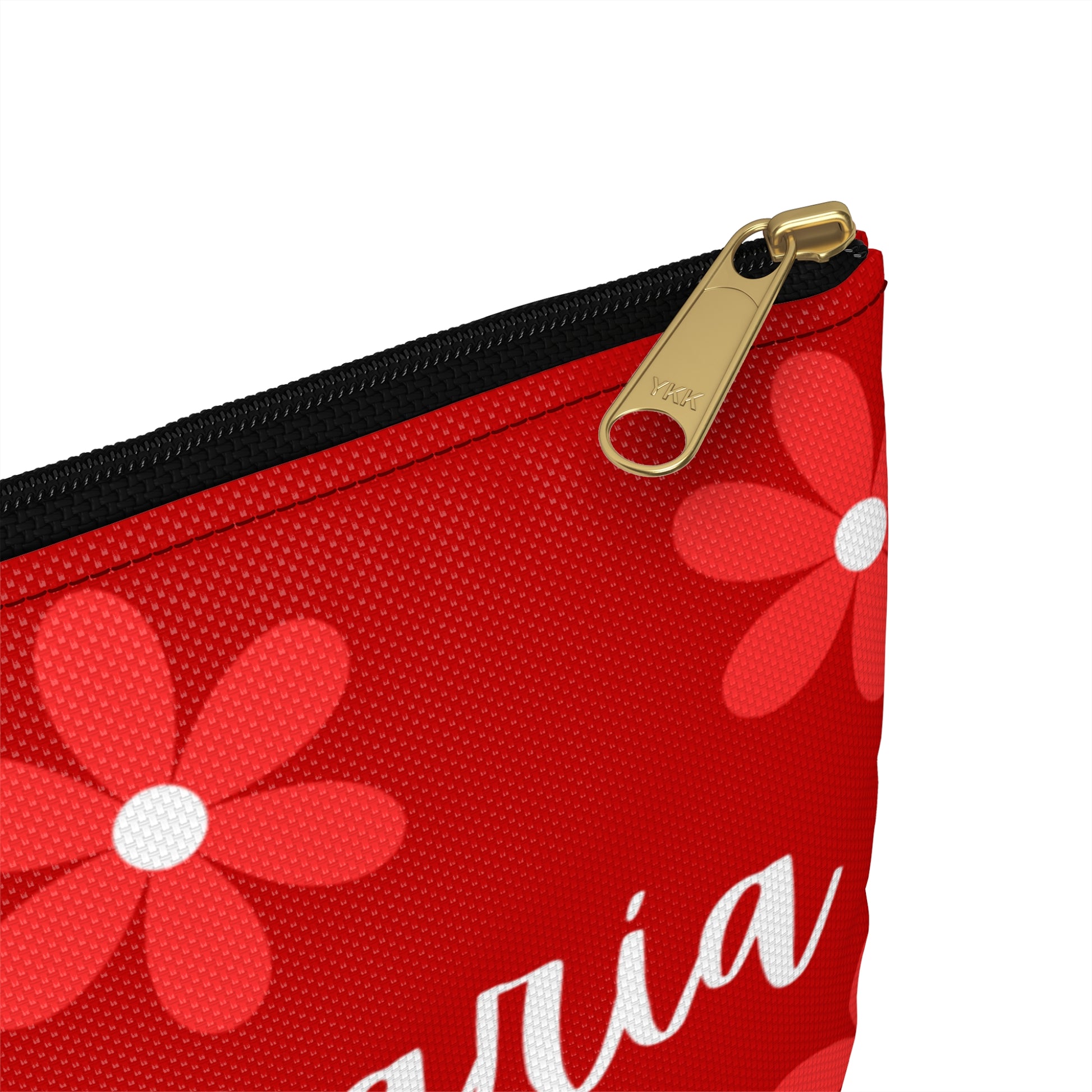 a red zippered pouch with a flower on it