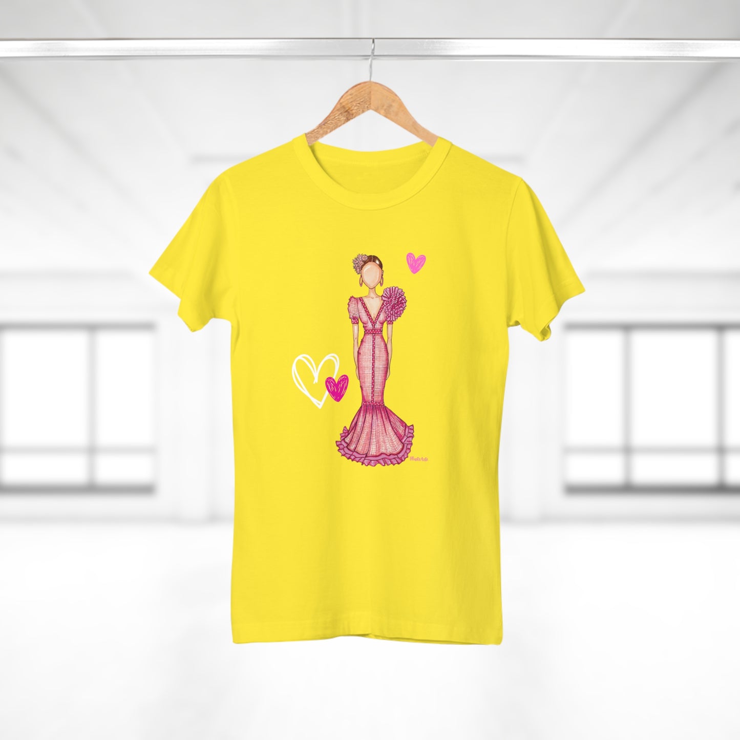a yellow t - shirt with a picture of a woman in a pink dress