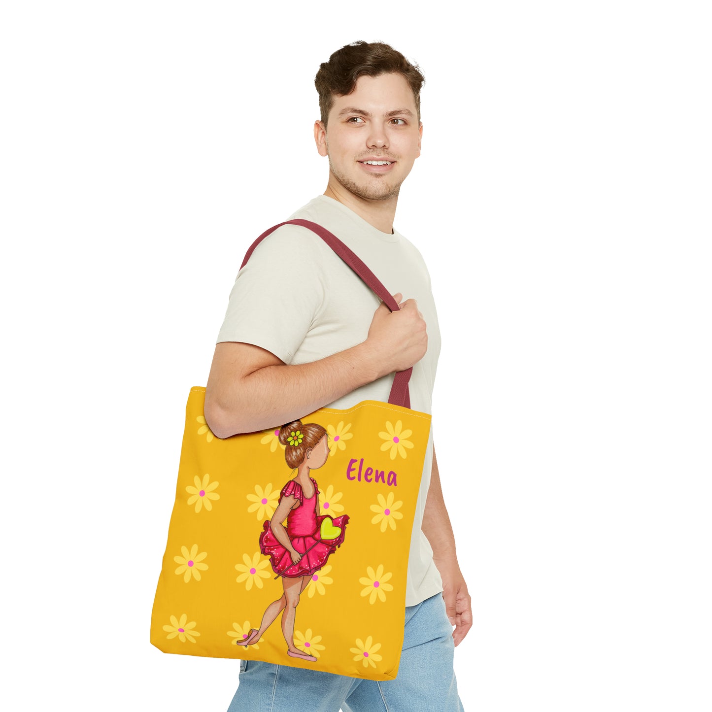 a man holding a yellow bag with a picture of a woman on it