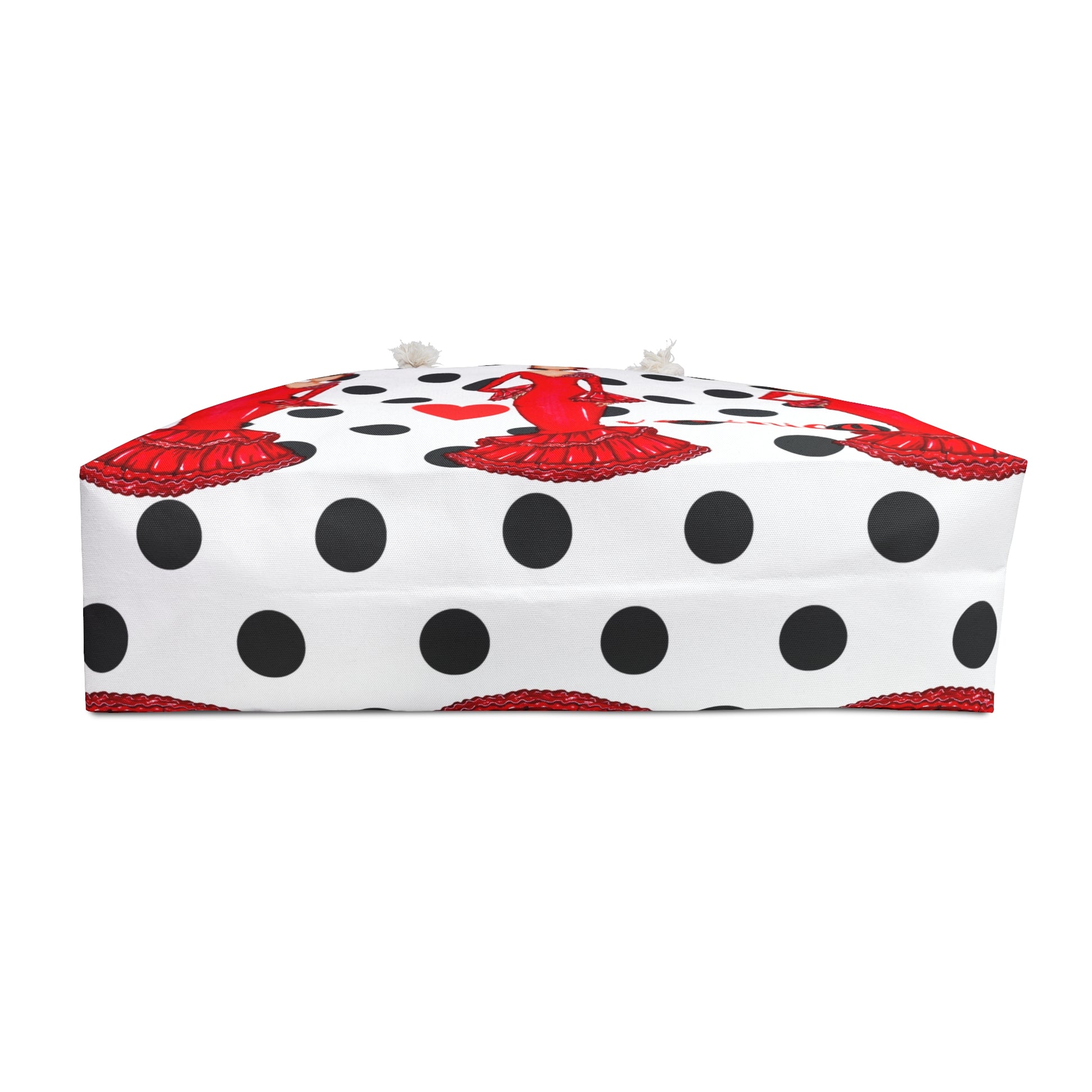 a white box with black dots and a red bow