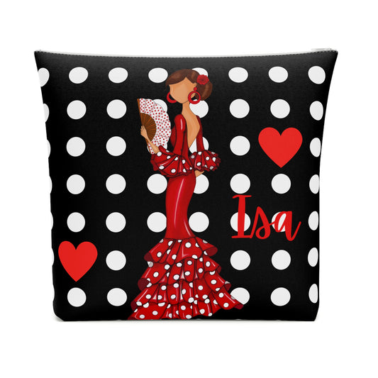 a black and white polka dot pillow with a lady in a red dress
