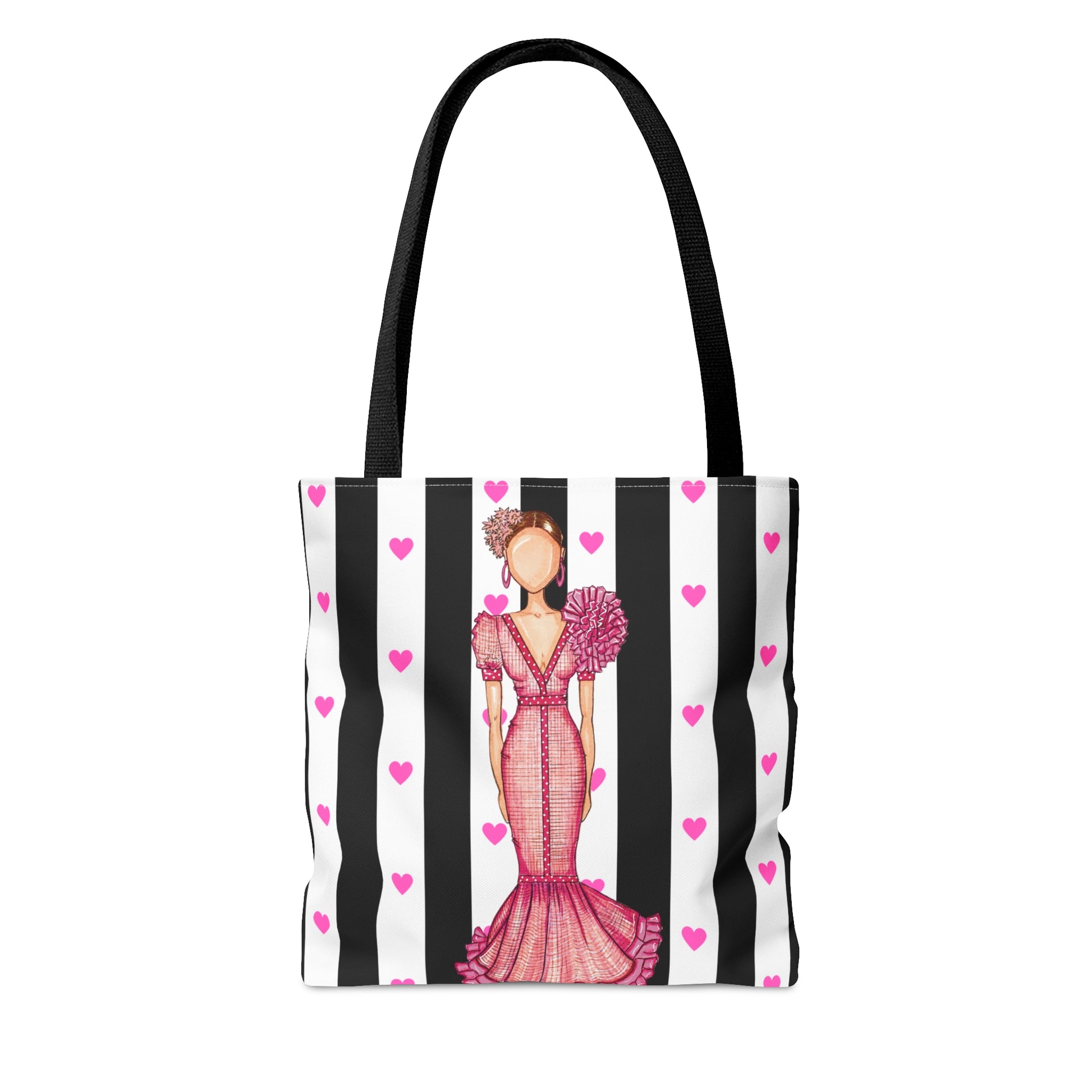 a black and white striped tote bag with a picture of a woman in a