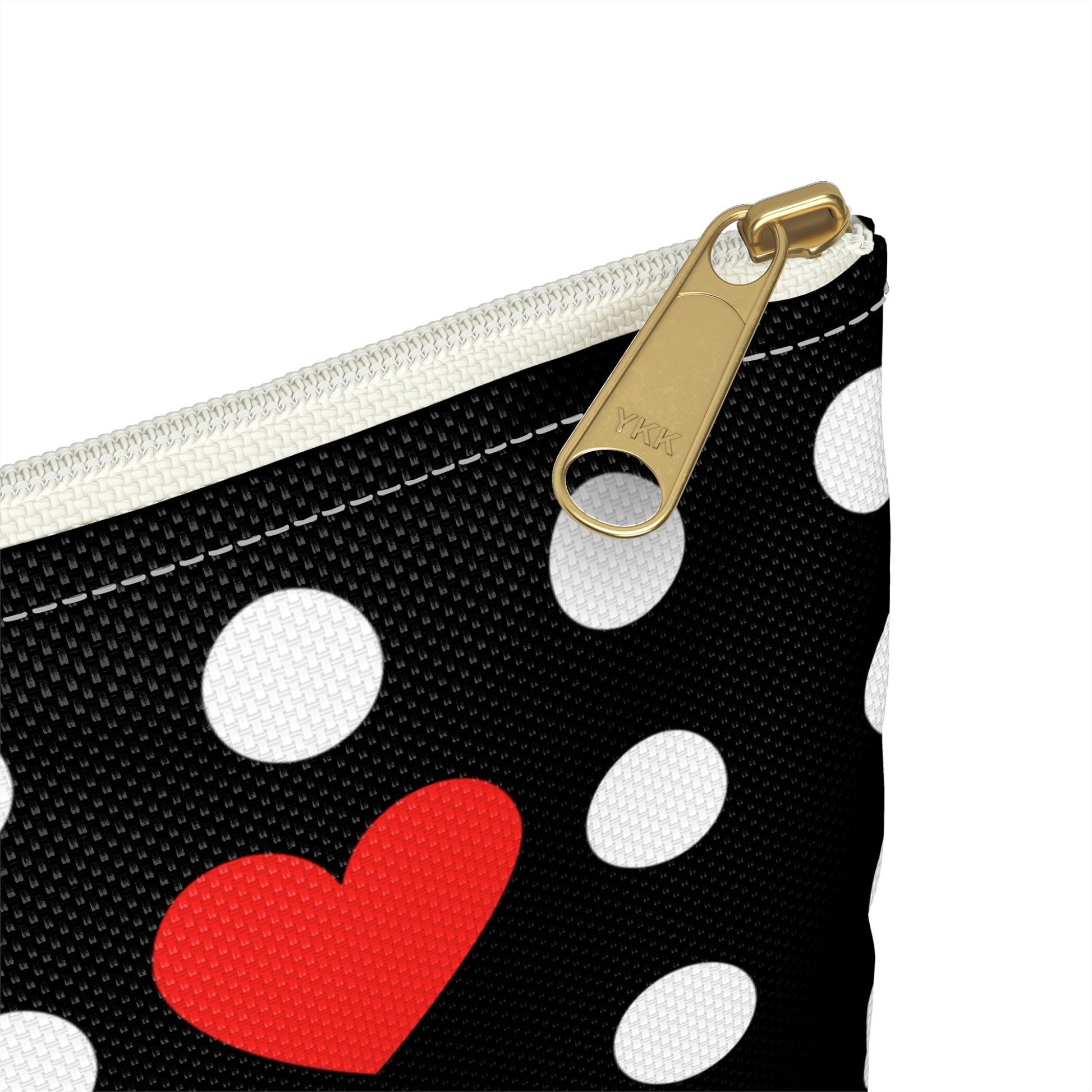 a polka dot purse with a red heart on it