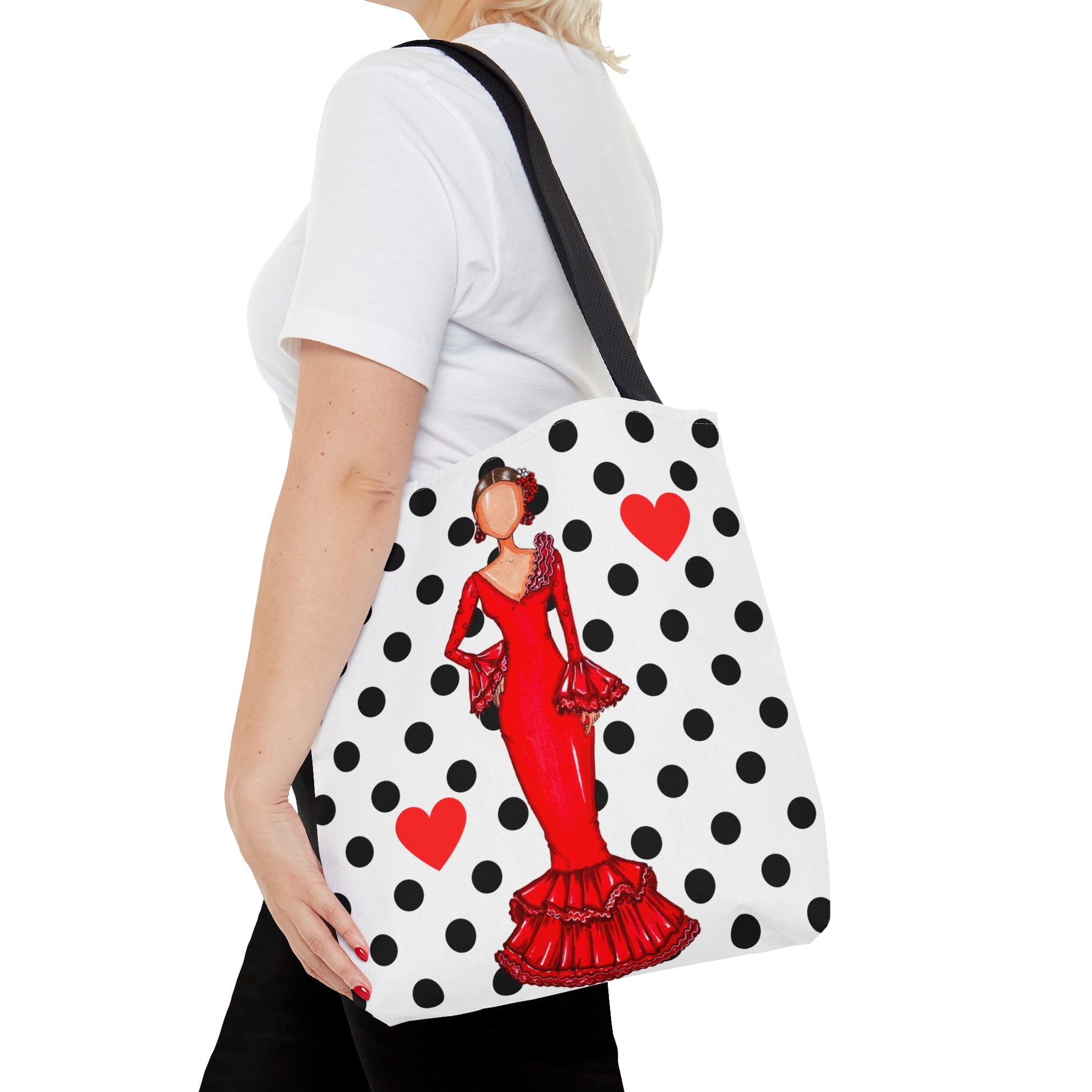 a woman carrying a polka dot purse with a picture of a woman in a red