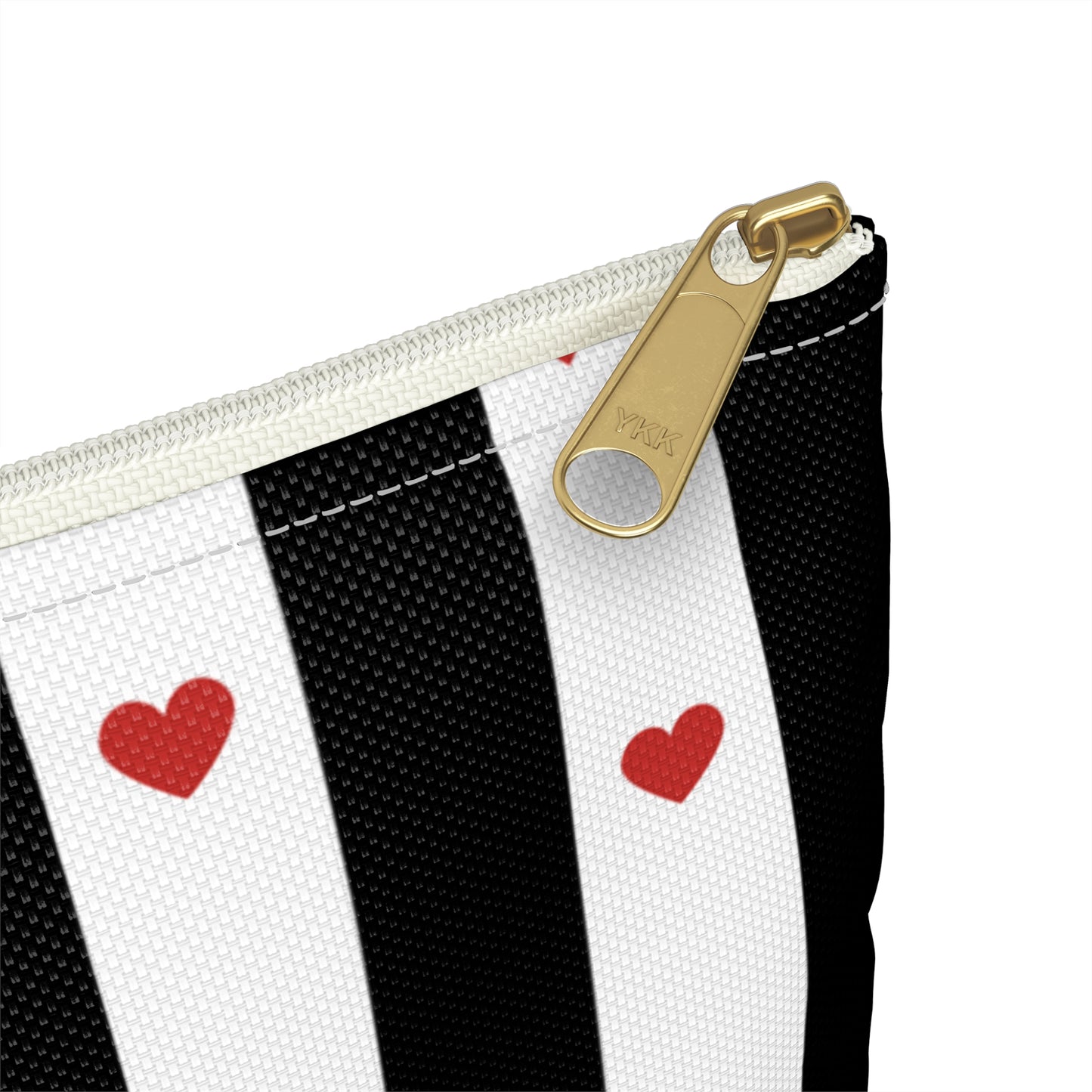 a black and white striped purse with red hearts on it