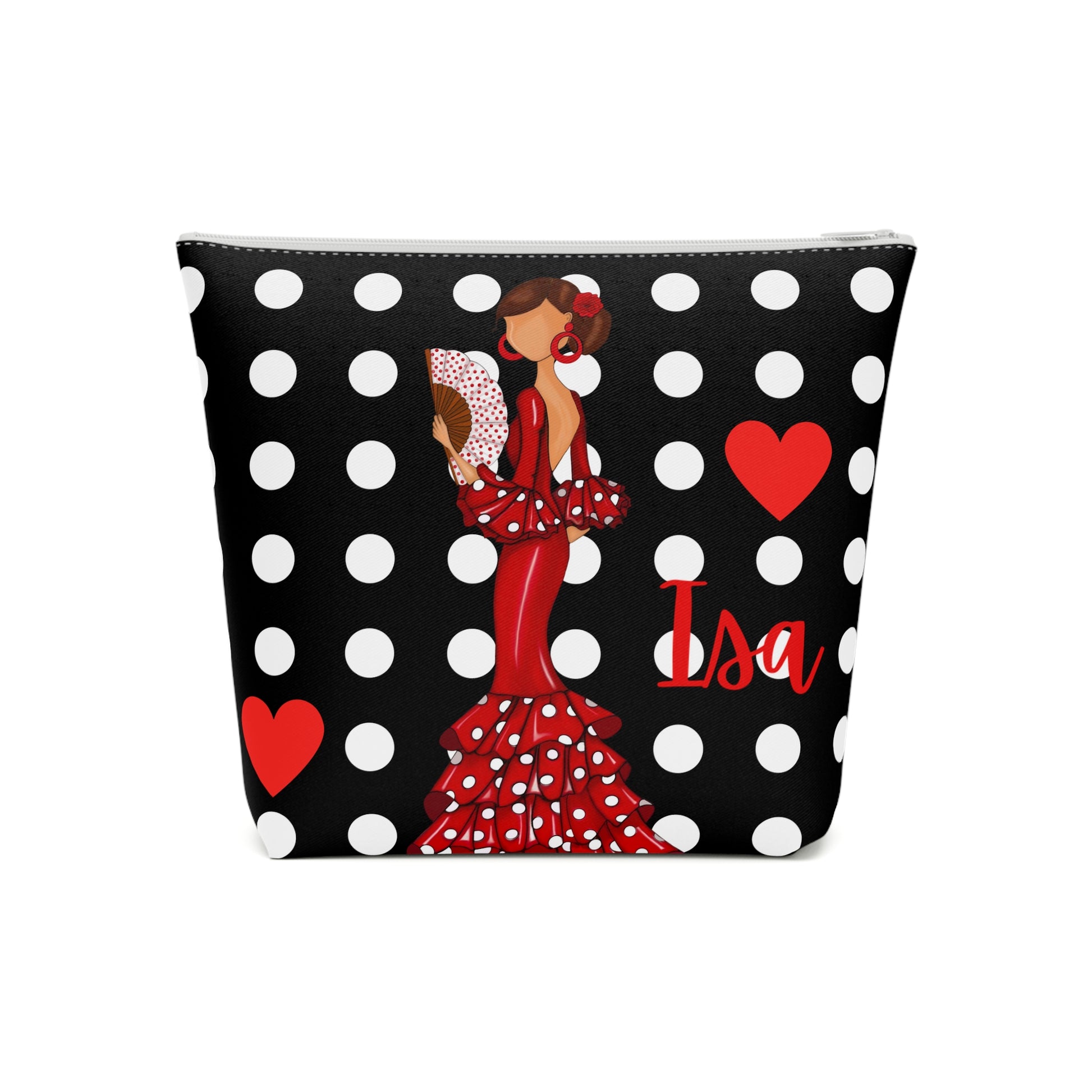 a black and white polka dot bag with a woman in a red dress holding a