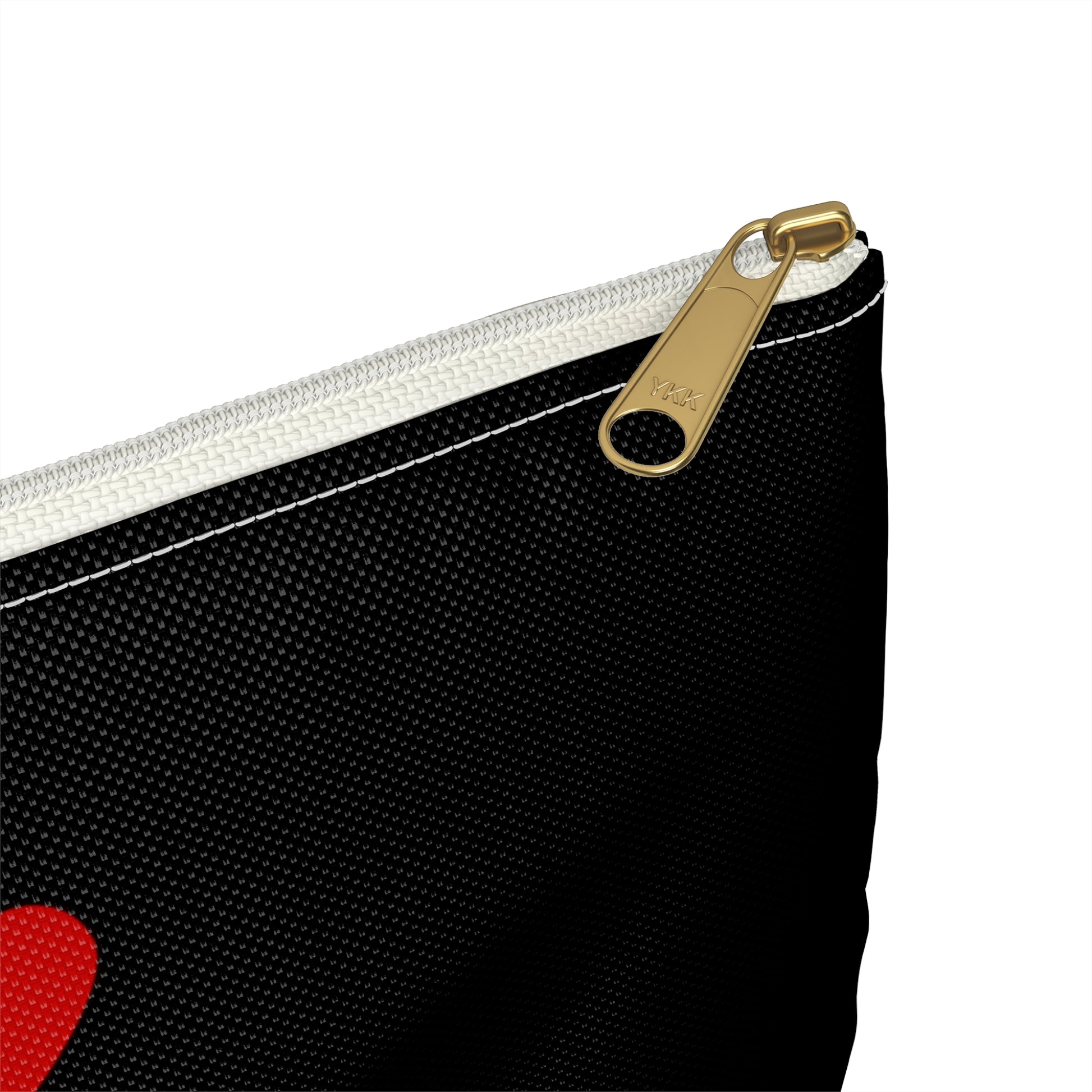 a black and white bag with a red heart on it