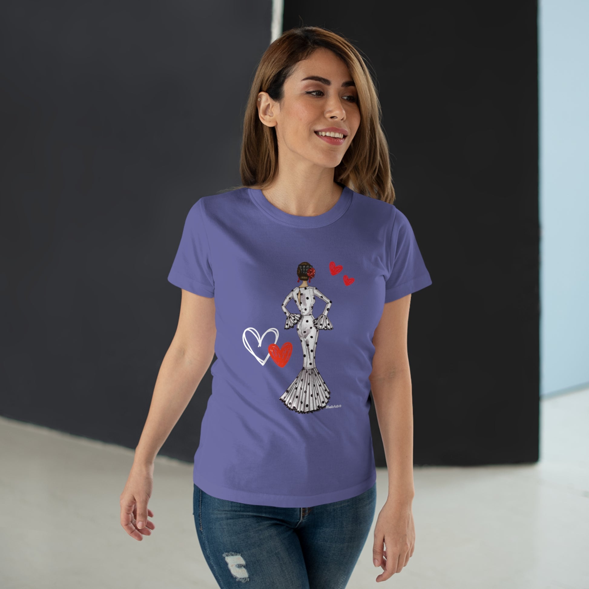 a woman wearing a t - shirt with a picture of a woman holding a heart