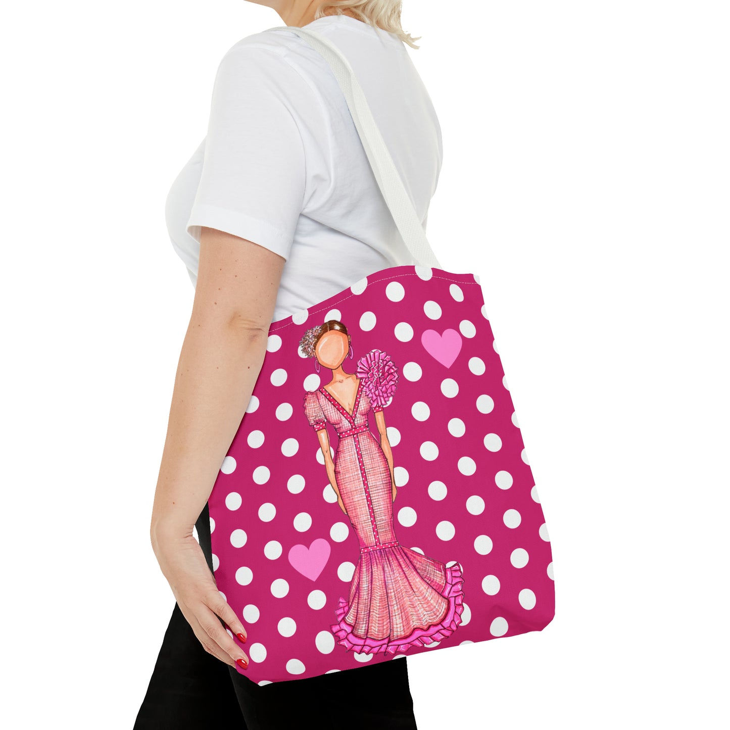a woman carrying a pink polka dot purse