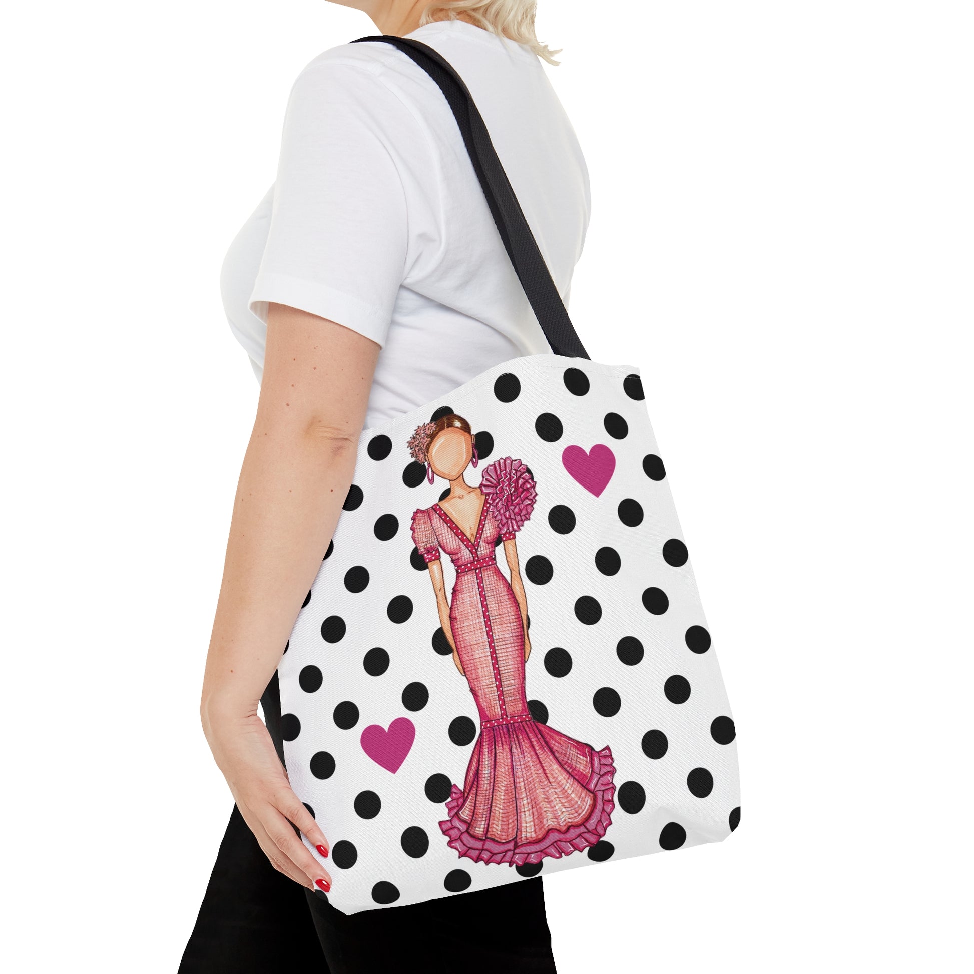 a woman is carrying a polka dot purse