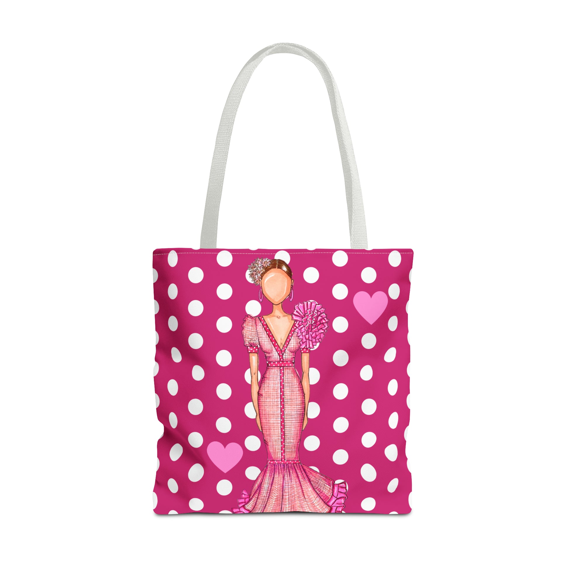 a pink and white polka dot bag with a lady holding a fan
