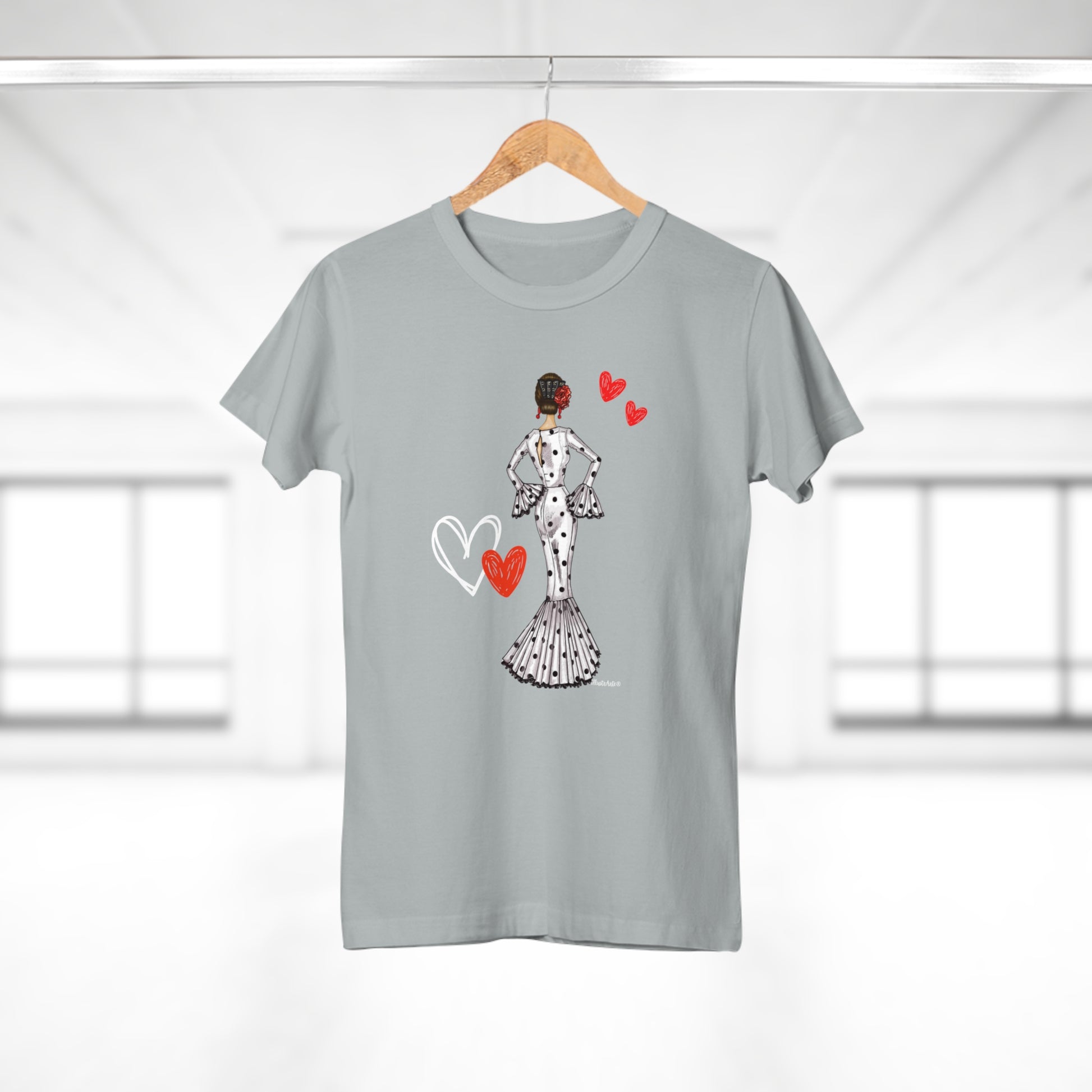 a t - shirt hanging on a clothes line with a woman in a dress and