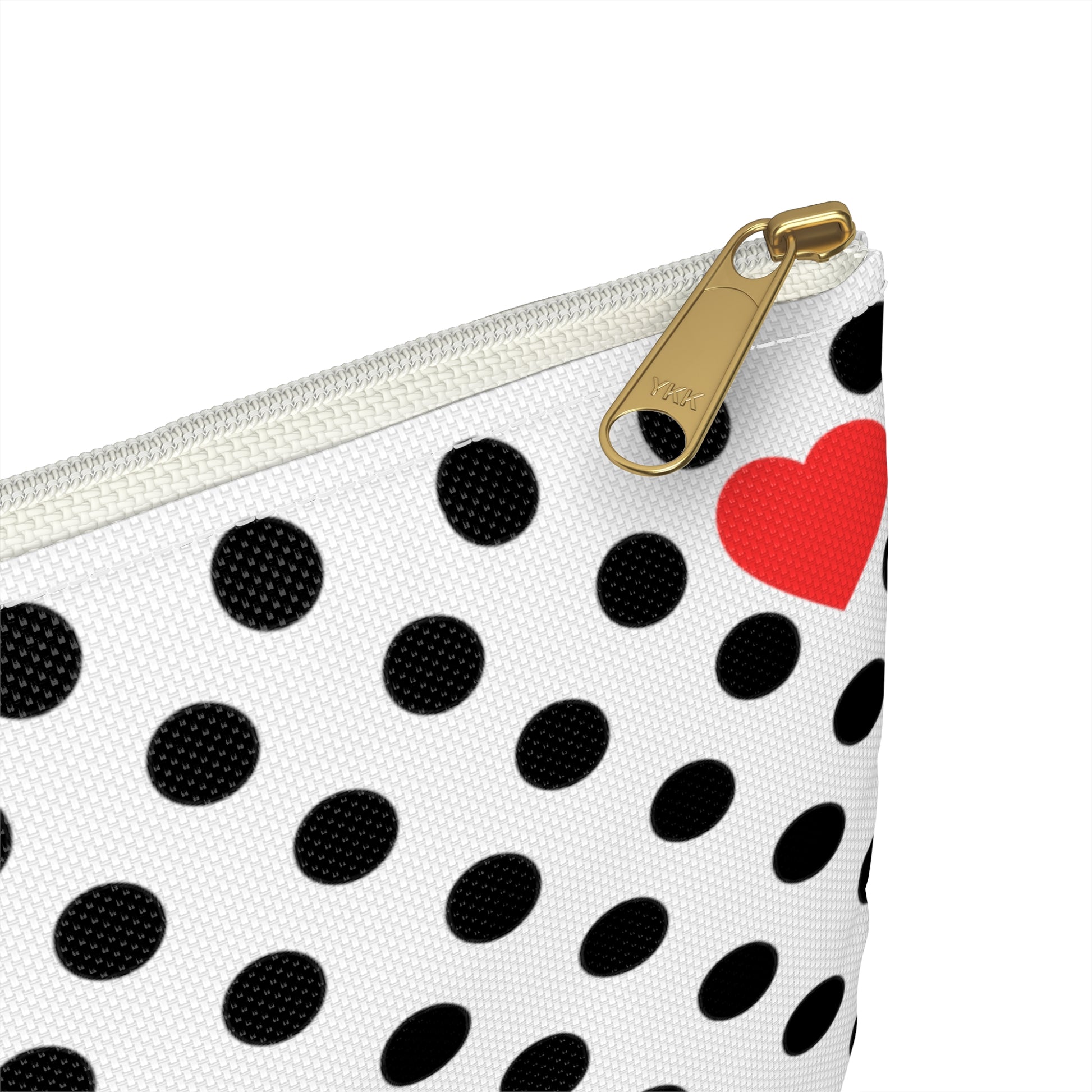 a polka dot purse with a heart on it