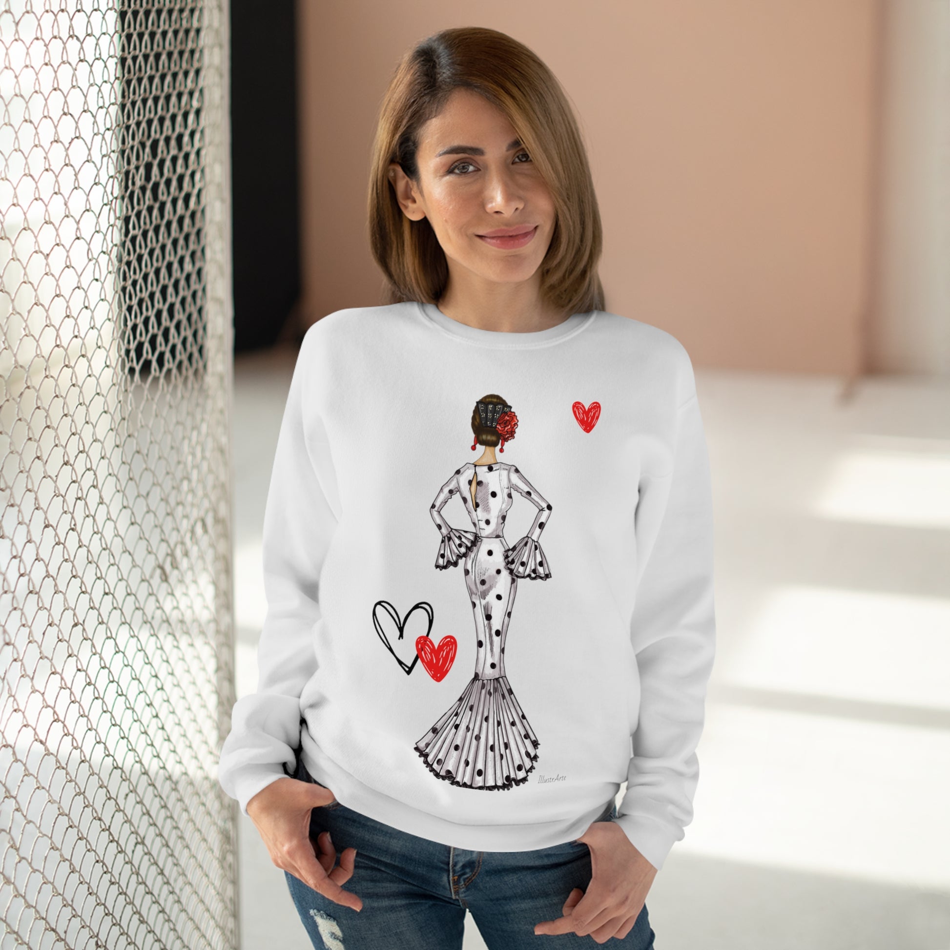 a woman wearing a white sweater with a picture of a woman on it