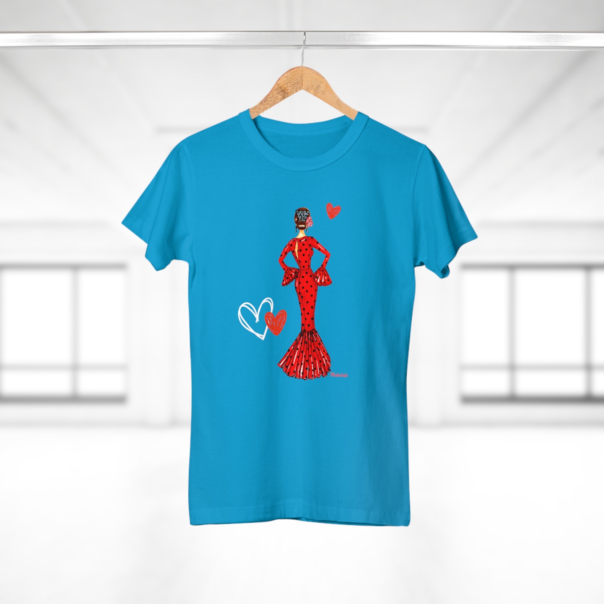 a blue t - shirt with a woman in a red dress holding a heart