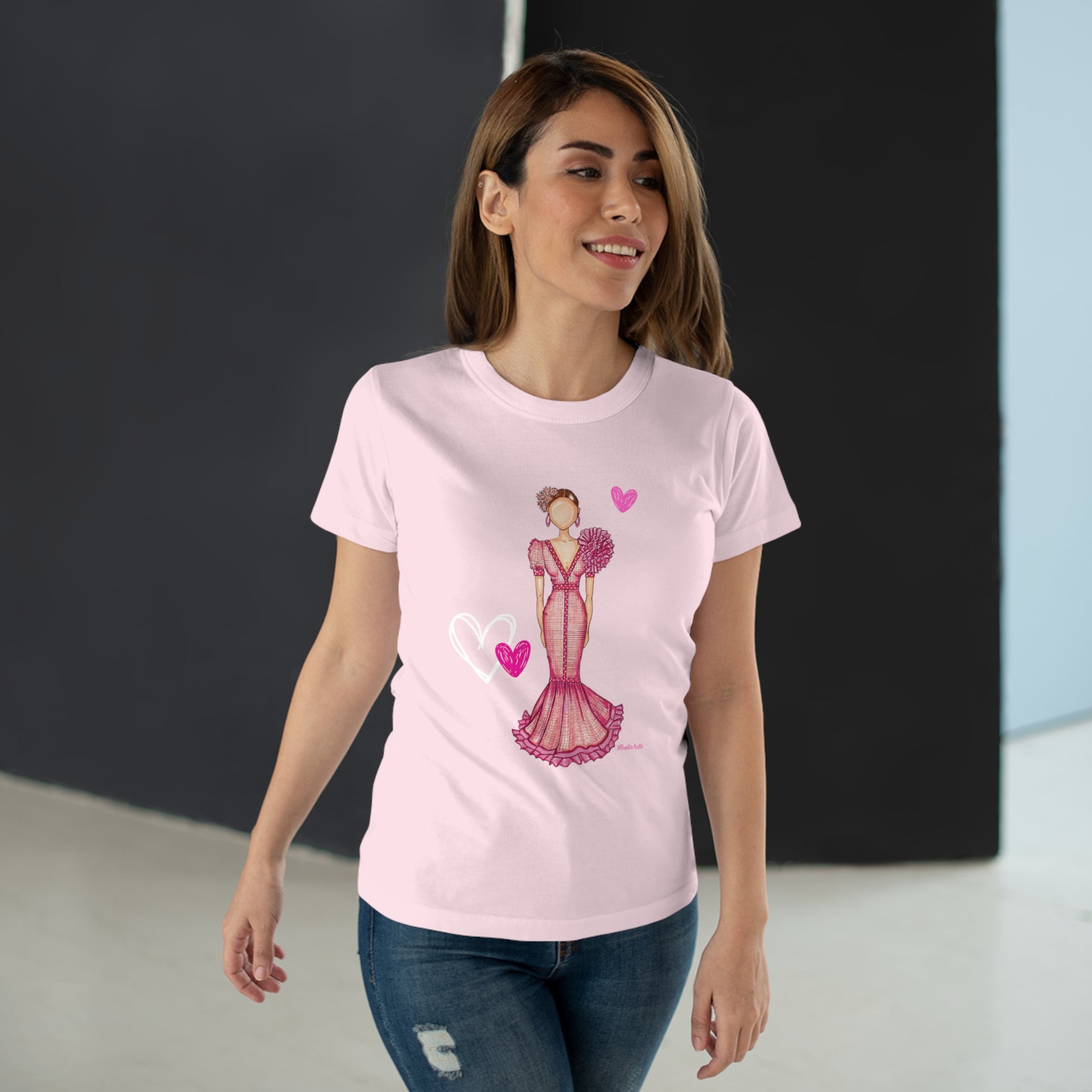 a woman wearing a pink t - shirt with a picture of a woman in a